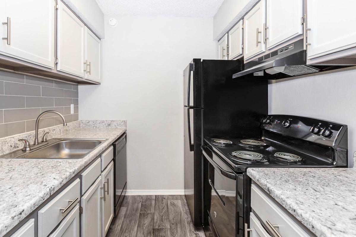 a large kitchen with stainless steel appliances