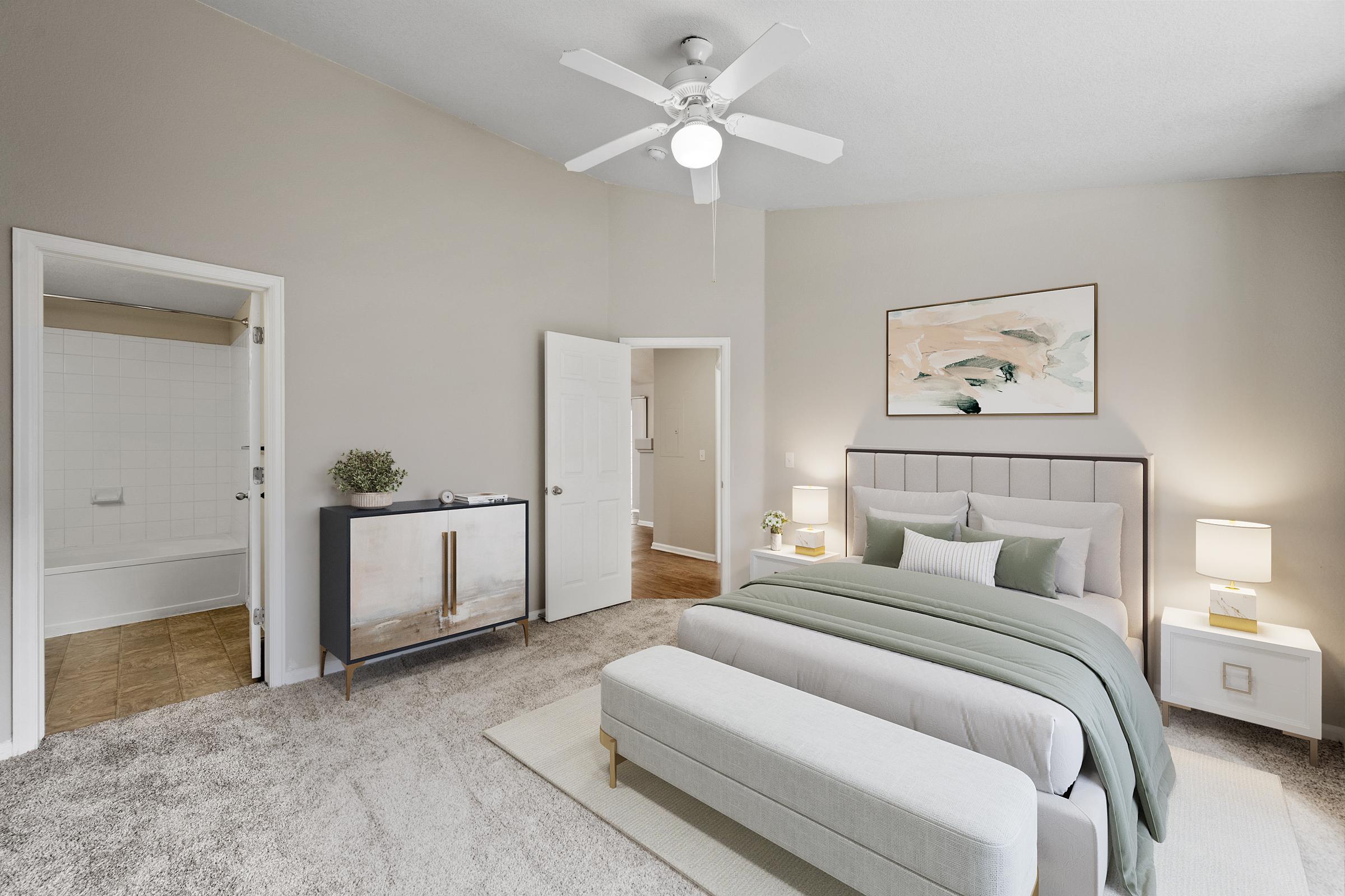 bedroom with ceiling fan and carpet.