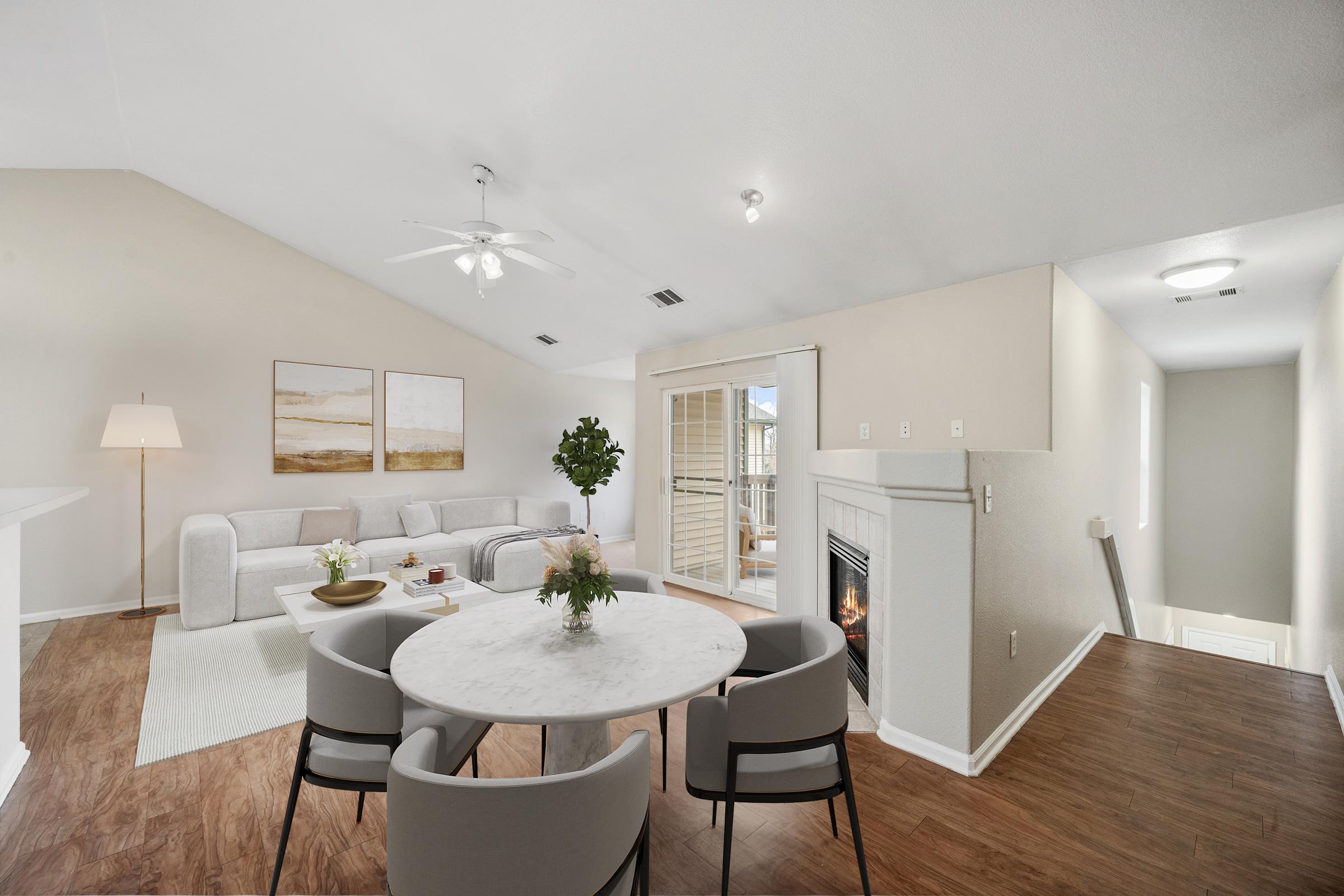 dining room with table chairs ceiling fan and lights.