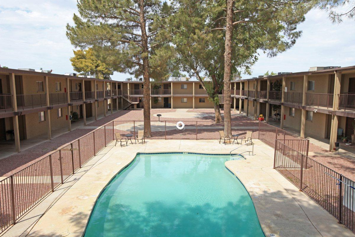 a pool next to a fence