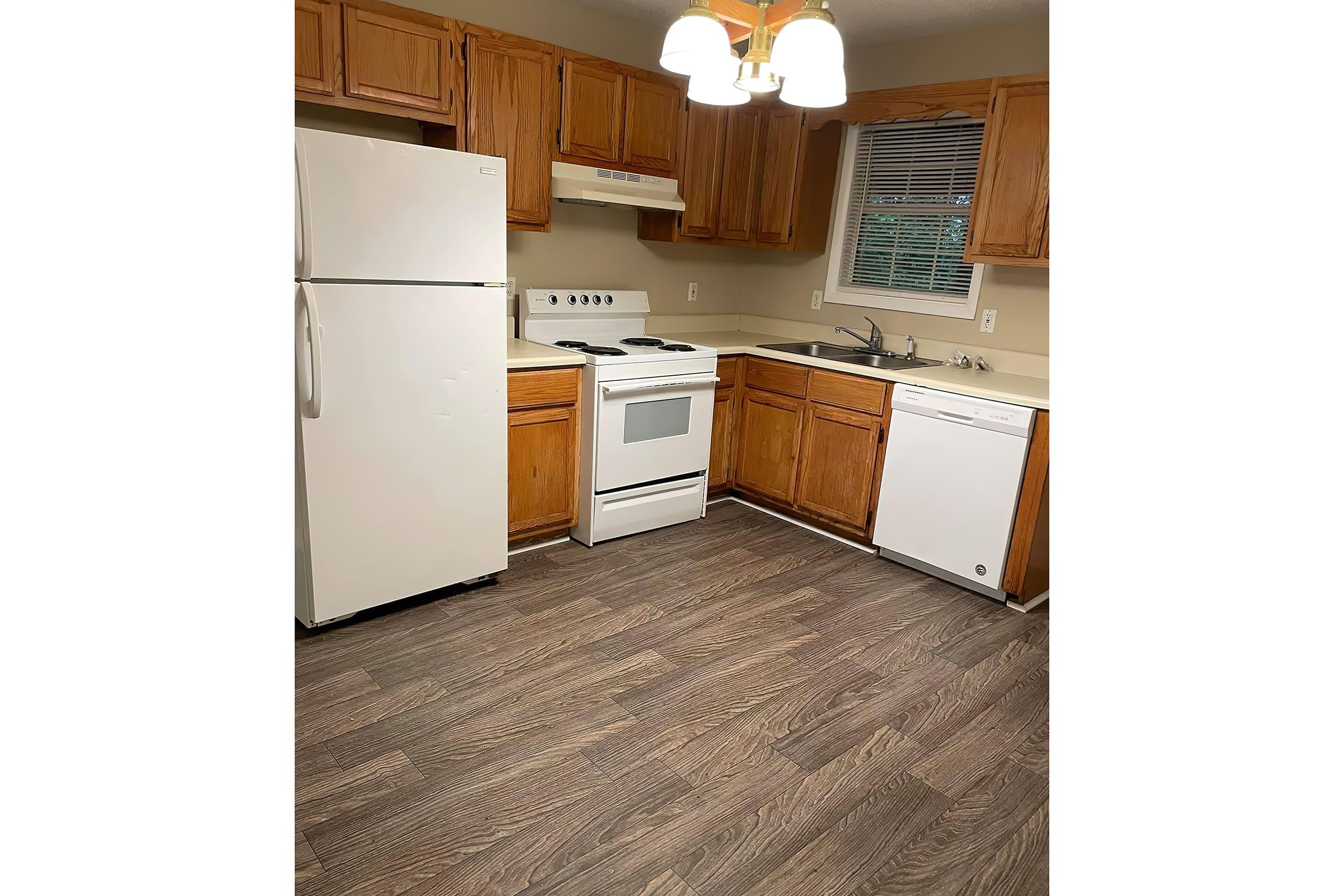 a kitchen with a stove and a refrigerator