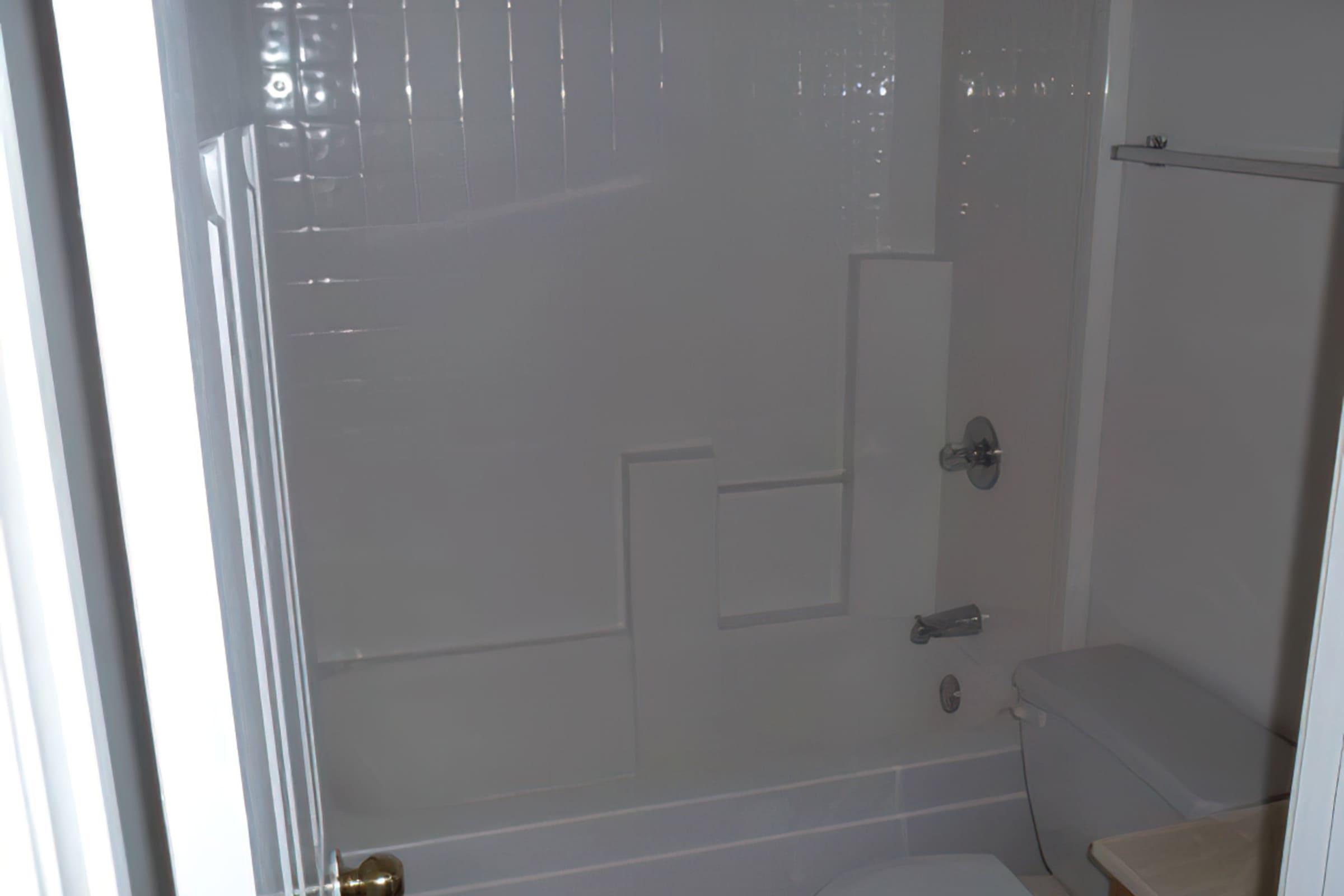 a close up of a shower in a small room