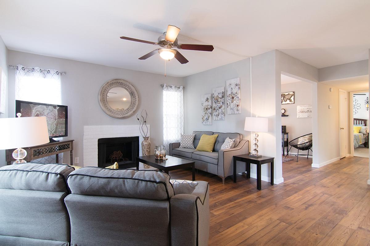 a living room filled with furniture and a fire place