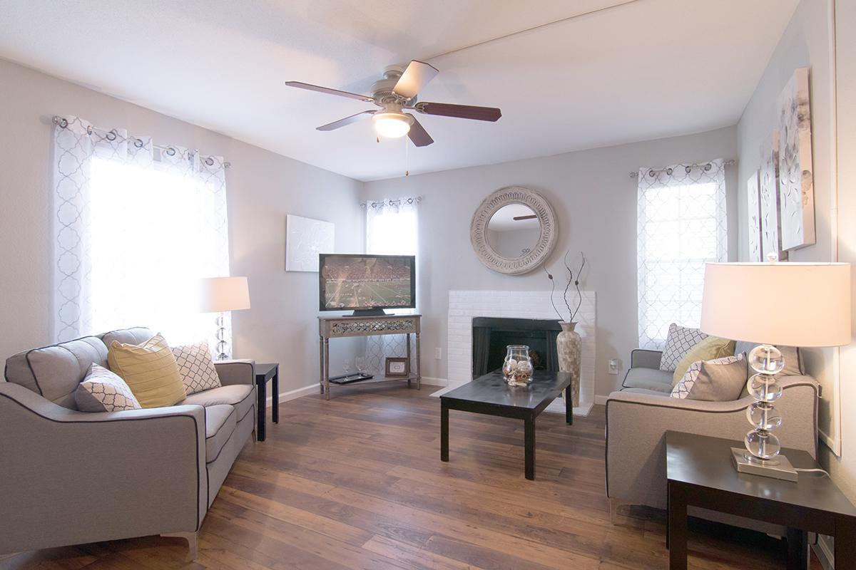 a living room filled with furniture and a fire place