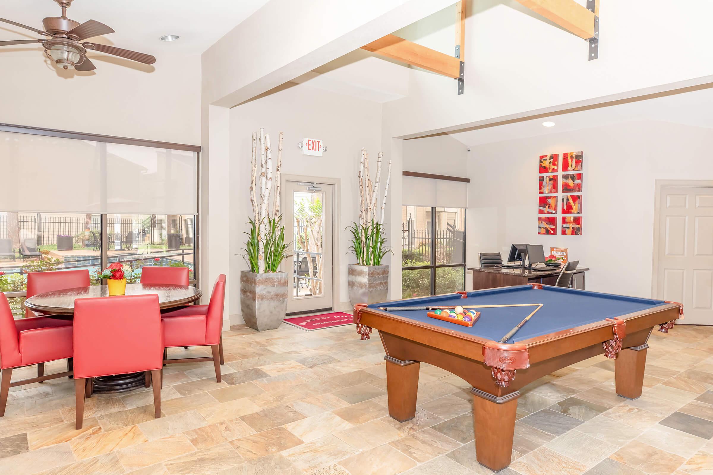 a living room filled with furniture and a table