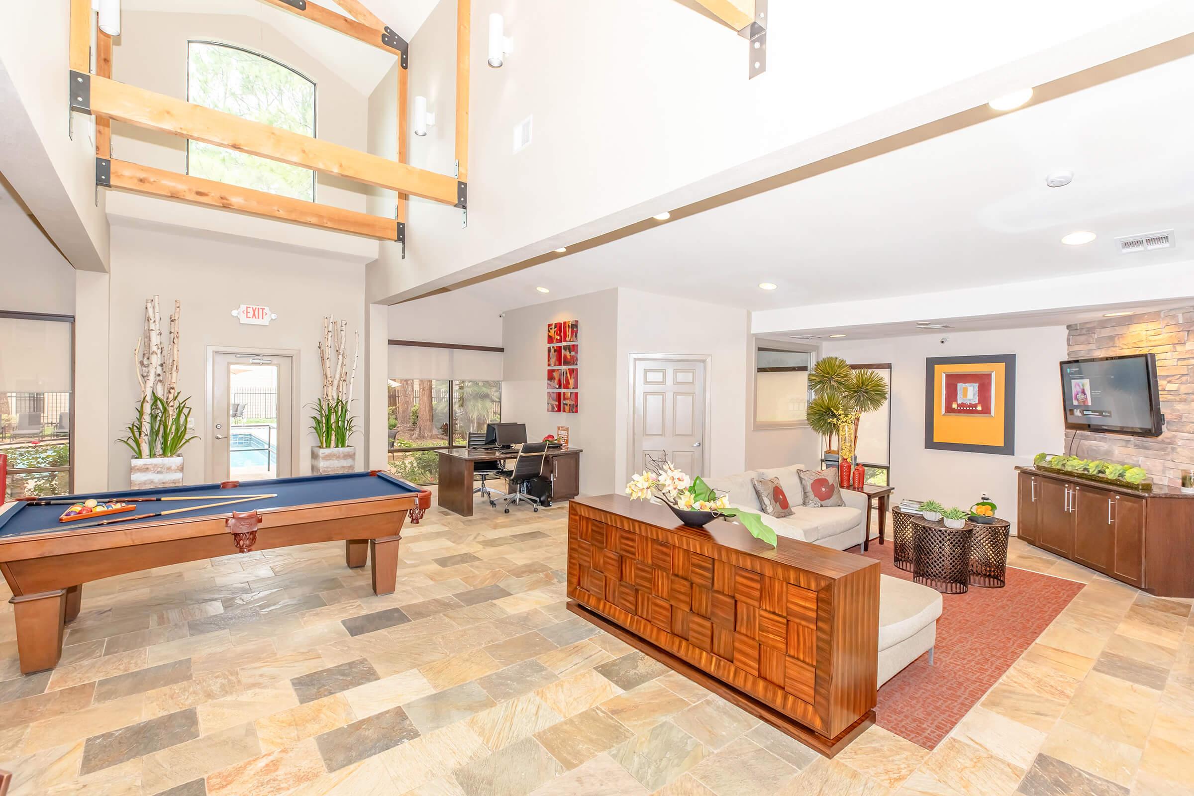 a living room filled with furniture and a fireplace