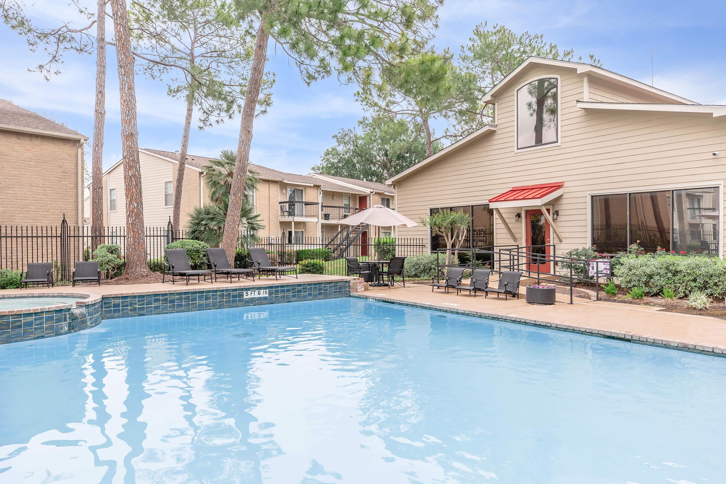 a house with a large pool of water