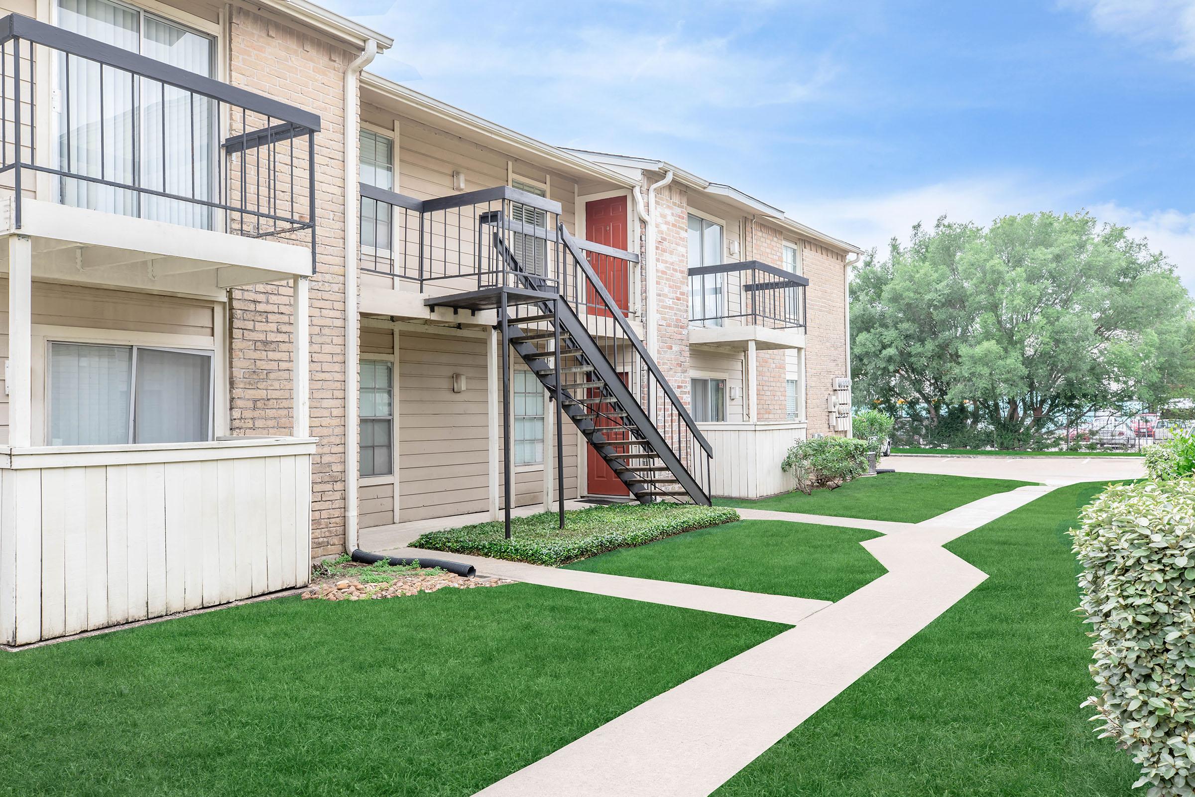 a large lawn in front of a building