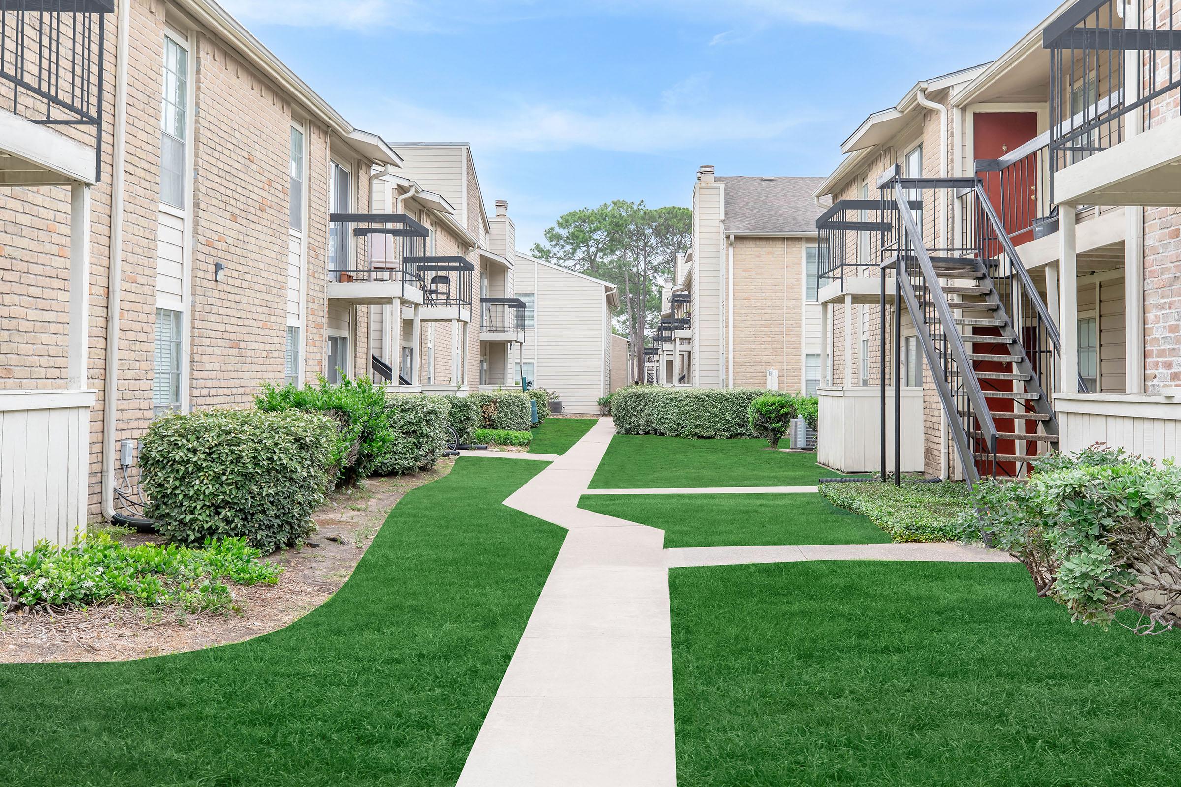 a large lawn in front of a house