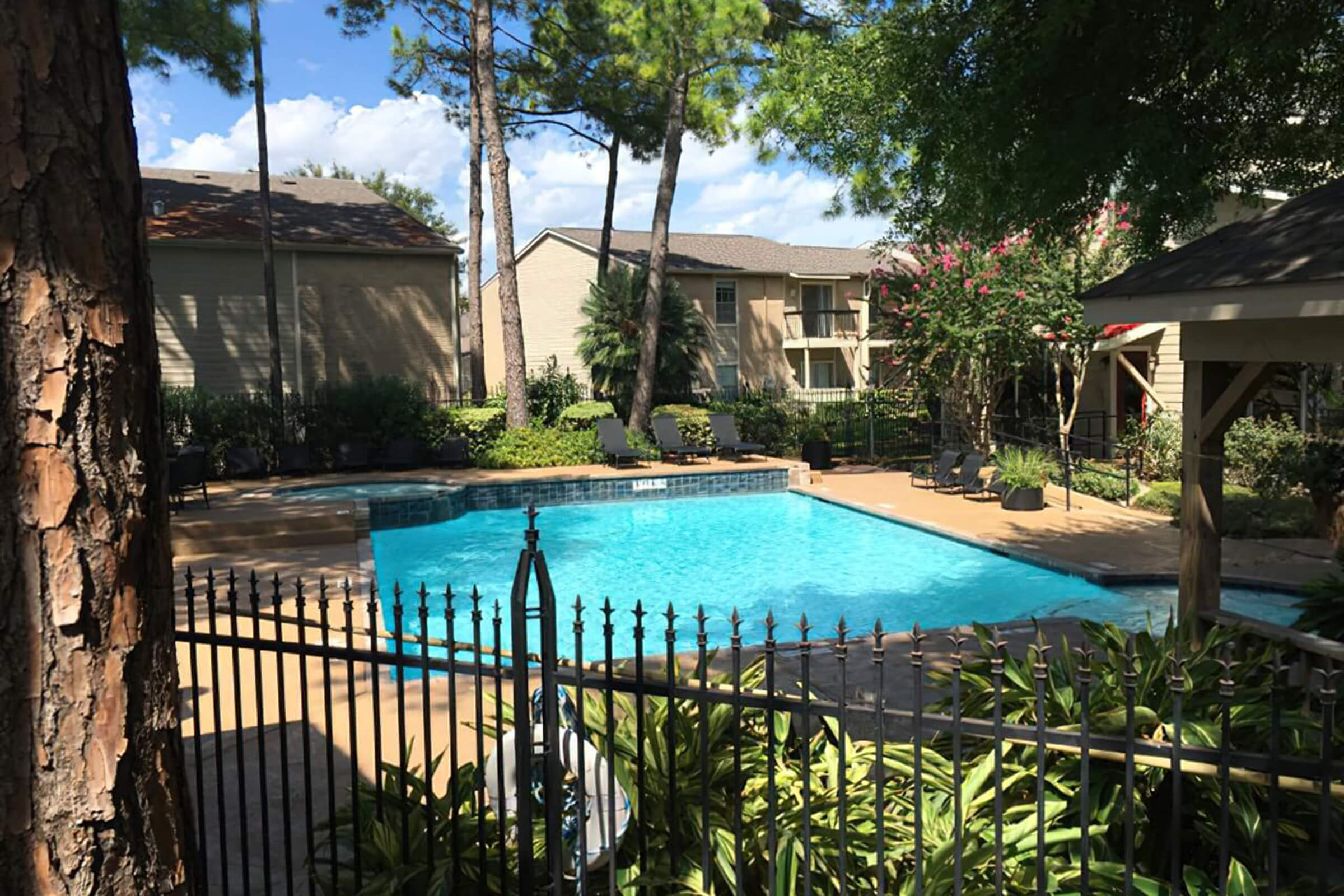 a large pool of water in front of a house