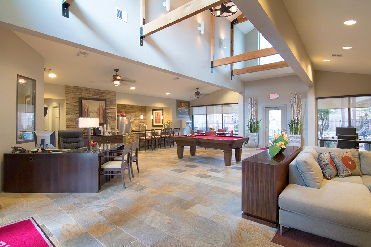 a living room filled with furniture and a large window