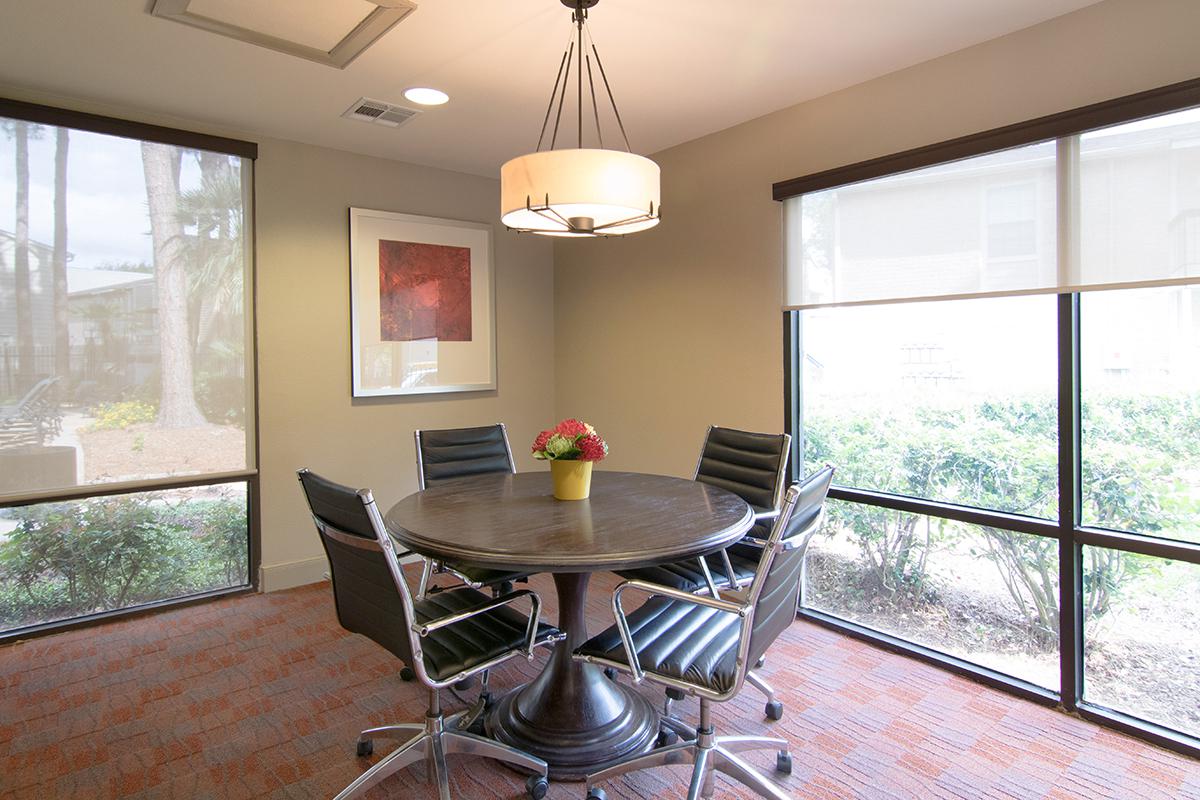 a living room filled with furniture and a large window