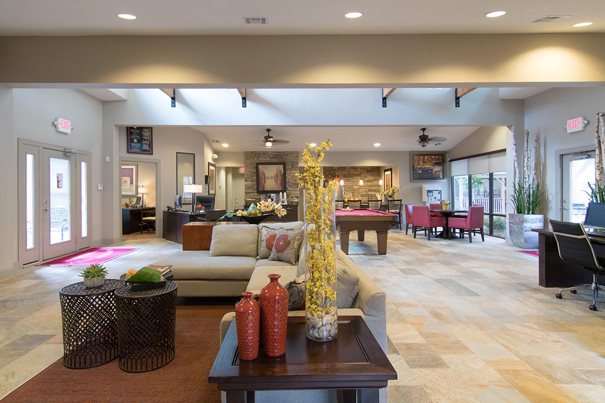 a living room filled with furniture and a fireplace