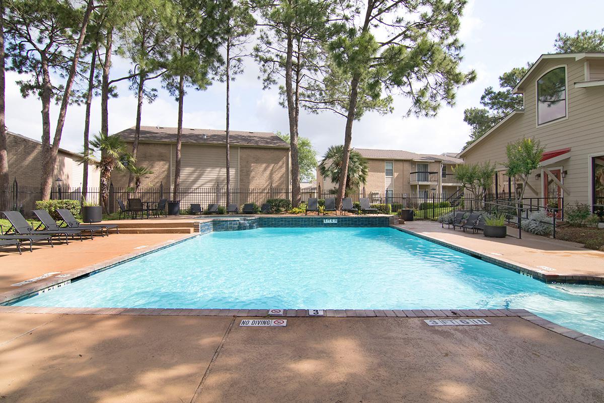 a pool of water in front of a house