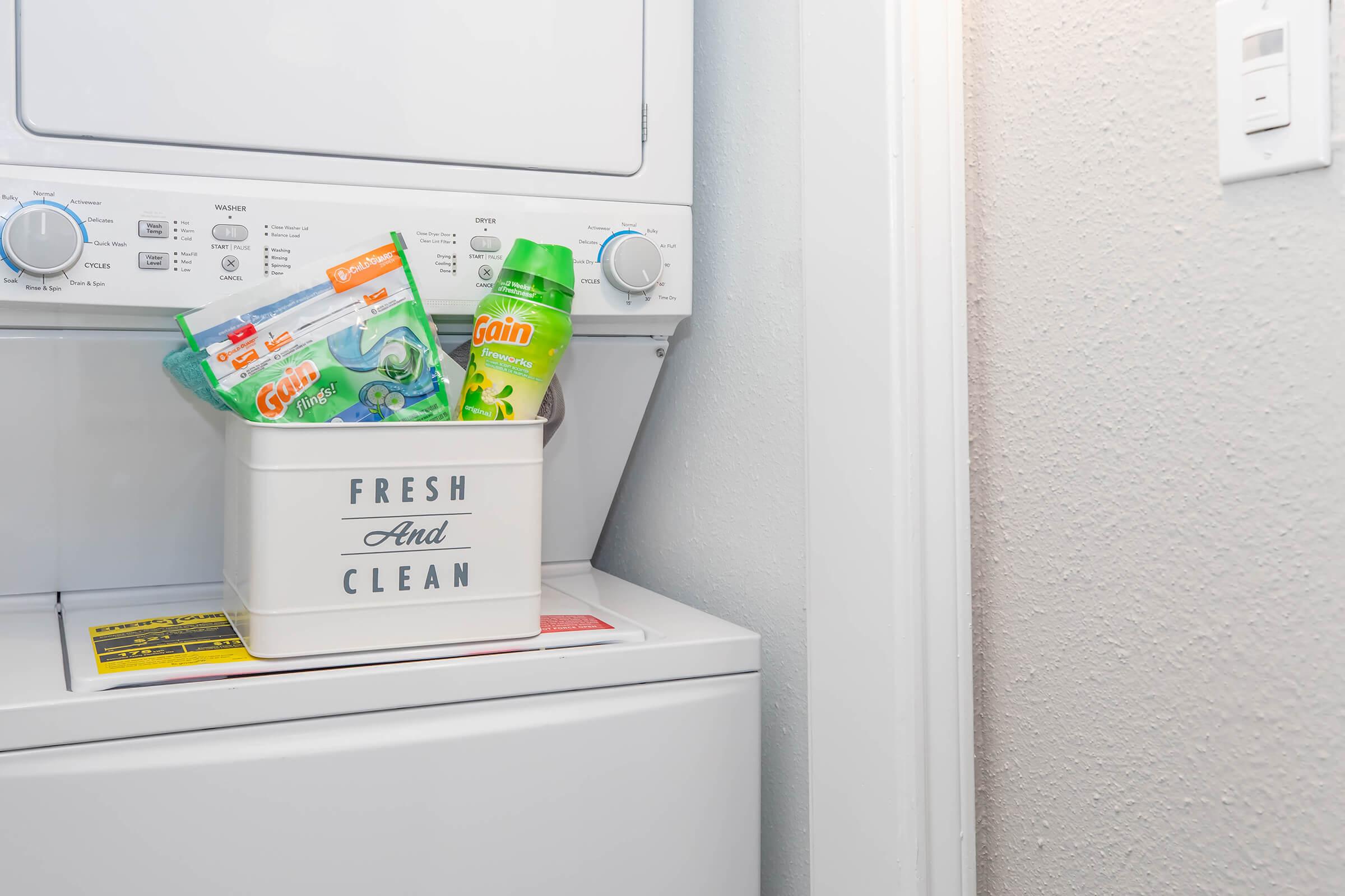 a microwave oven sitting on top of a refrigerator