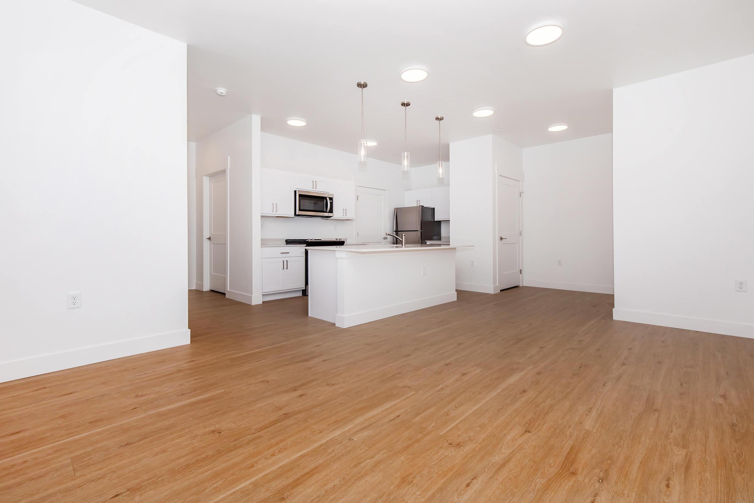 a kitchen with a wood floor