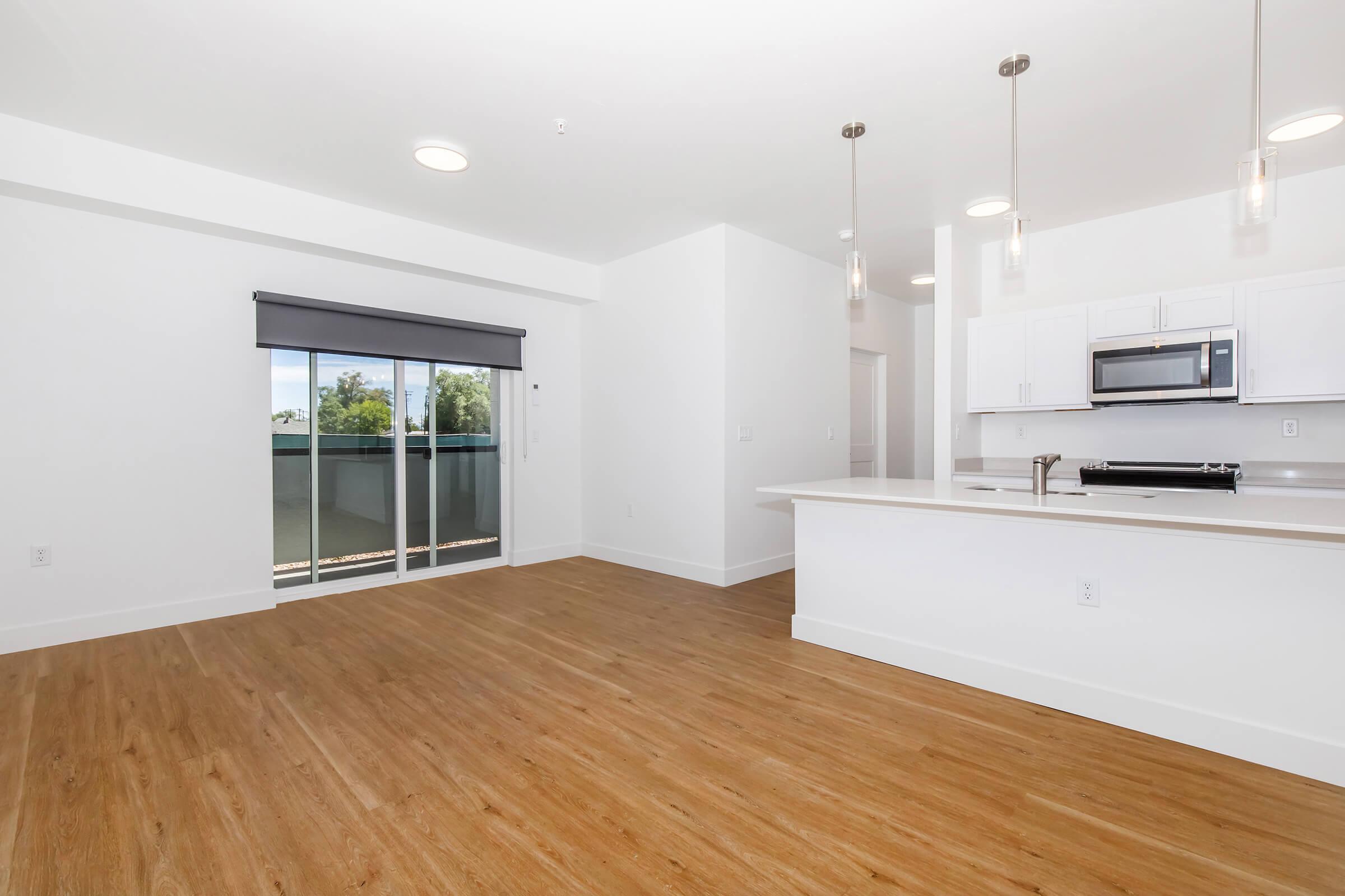 a kitchen with a wood floor