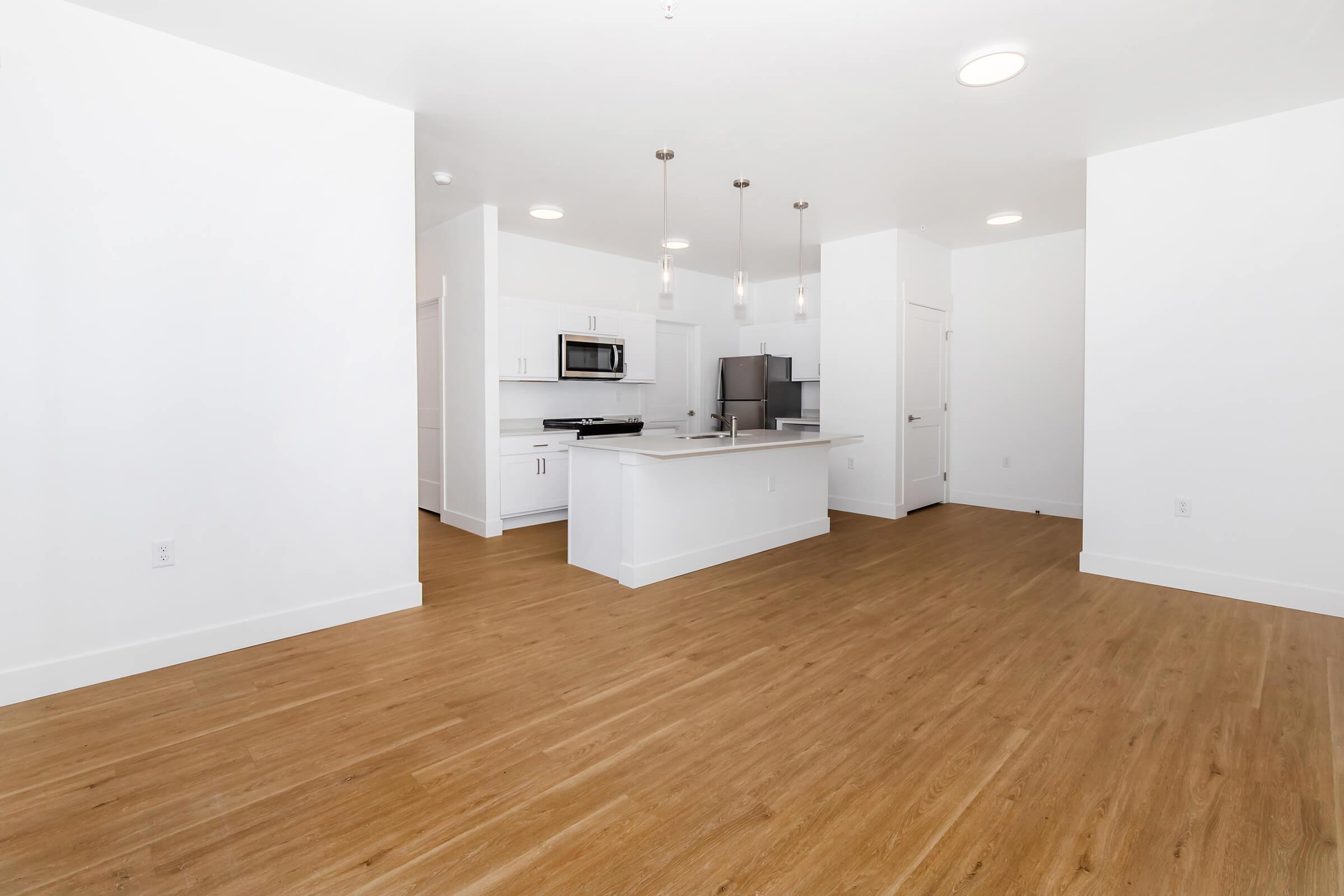 a kitchen with a wood floor