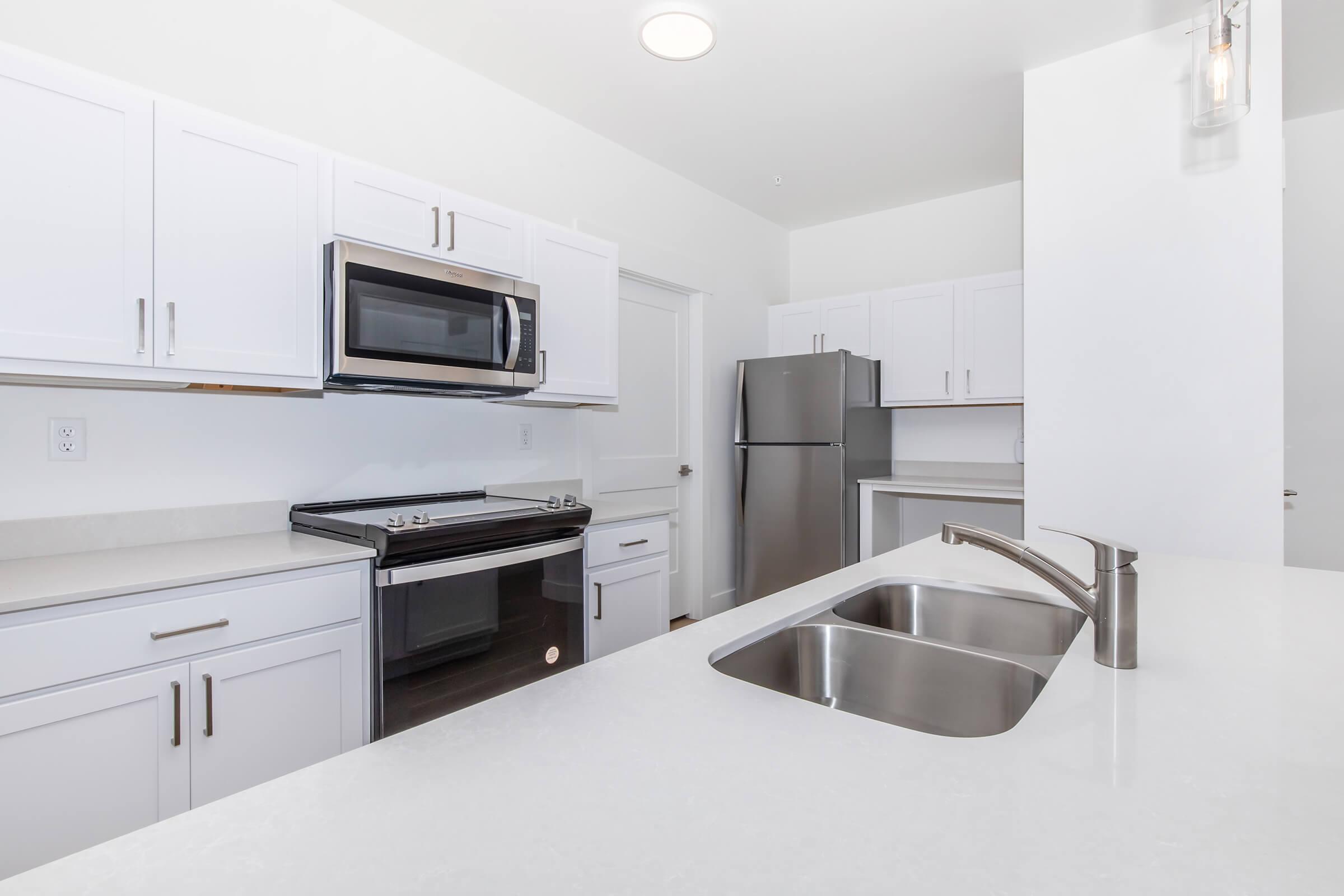 a kitchen with a stove and a sink