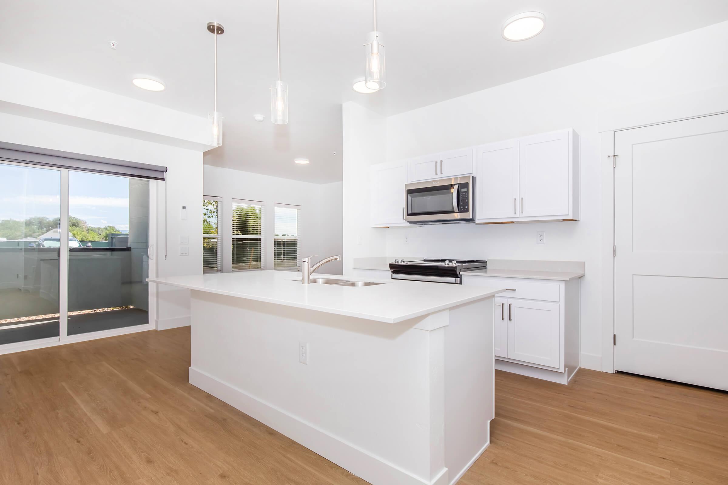 a kitchen with a wooden floor