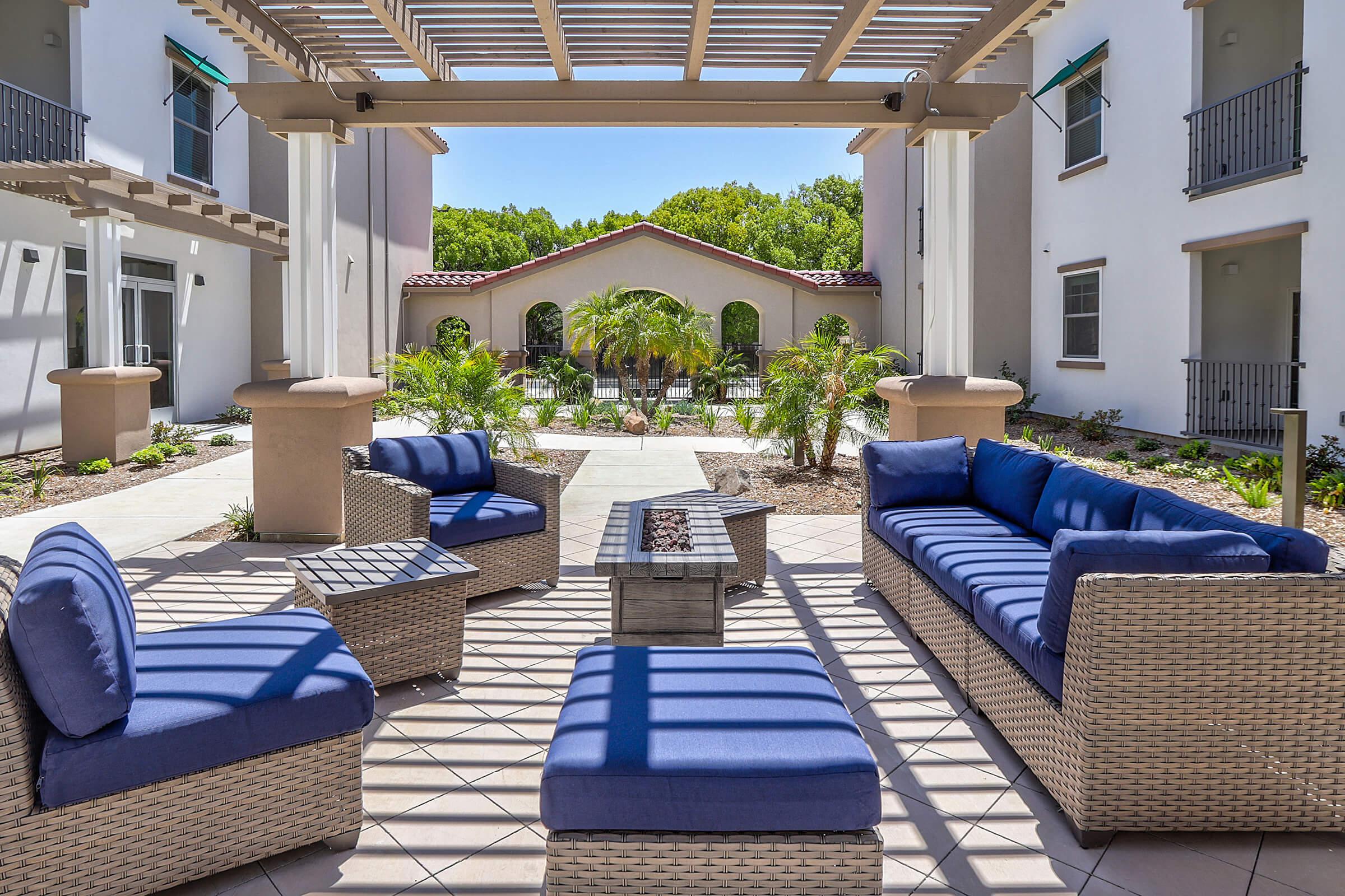 a living room with a pool in front of a building