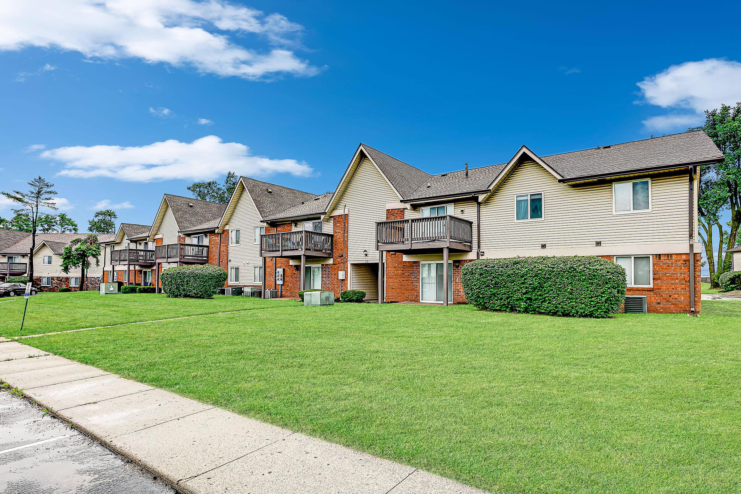 a large lawn in front of a building