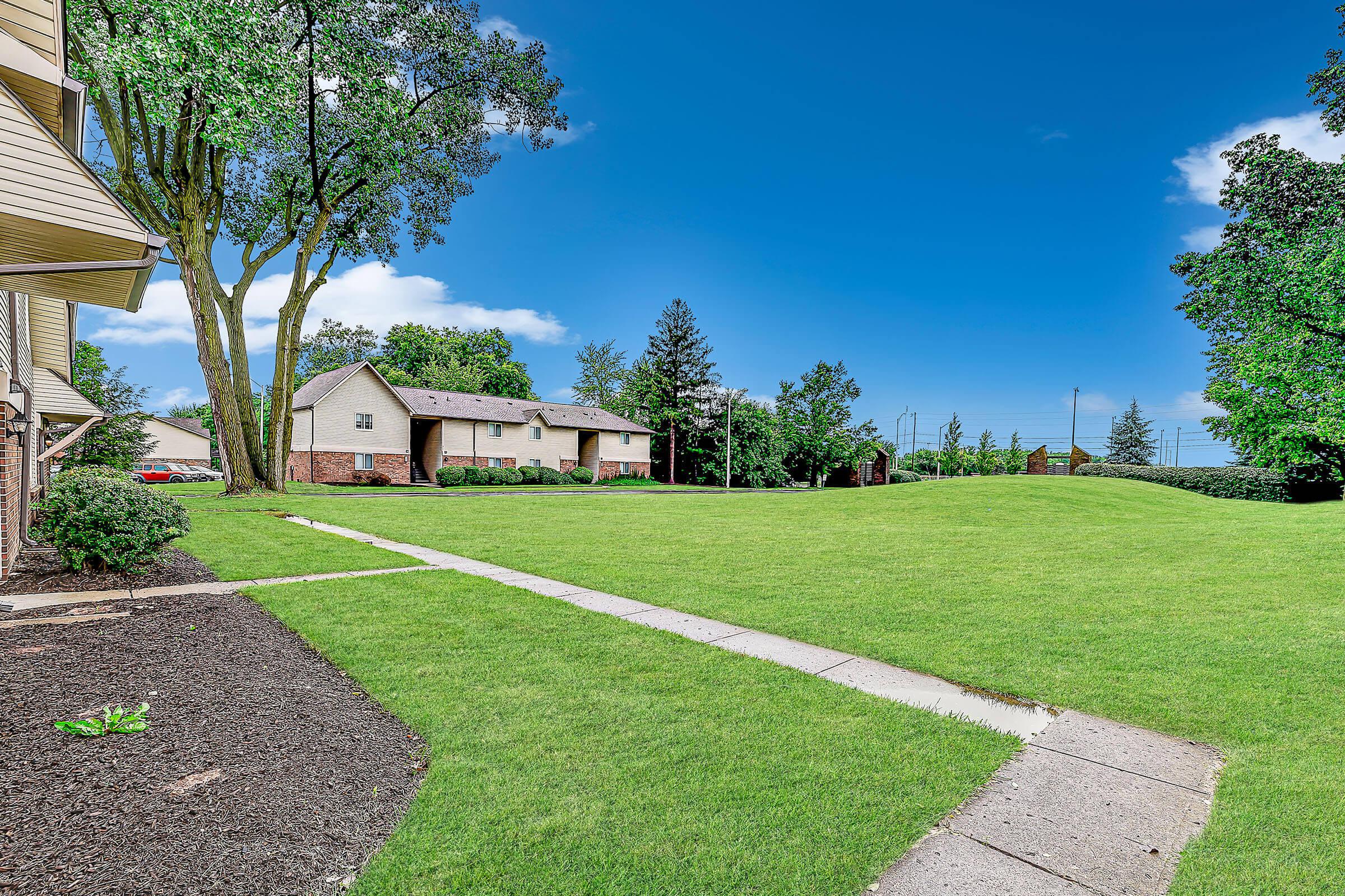 a garden with a green lawn