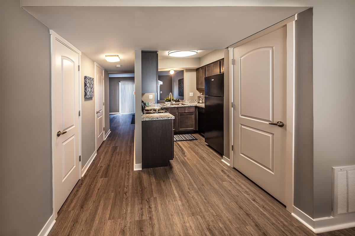 a kitchen with a wood floor