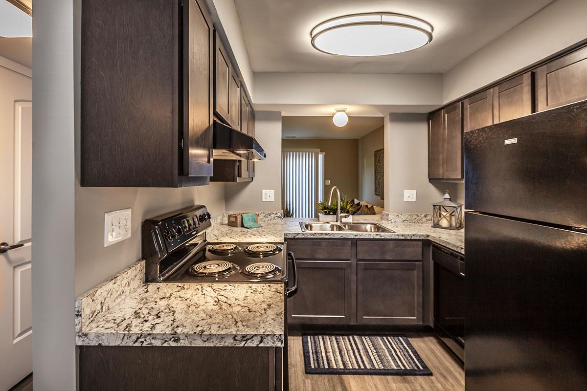 a modern kitchen with an island in the middle of a room