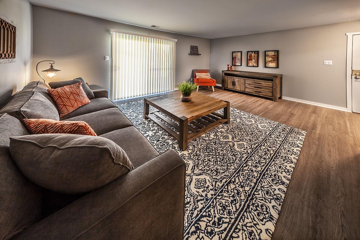 a bedroom with a view of a living room