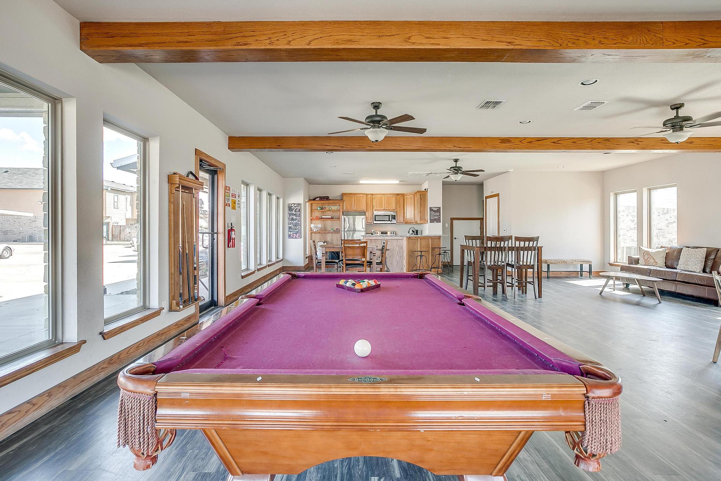 a wooden bench sitting in the middle of a room