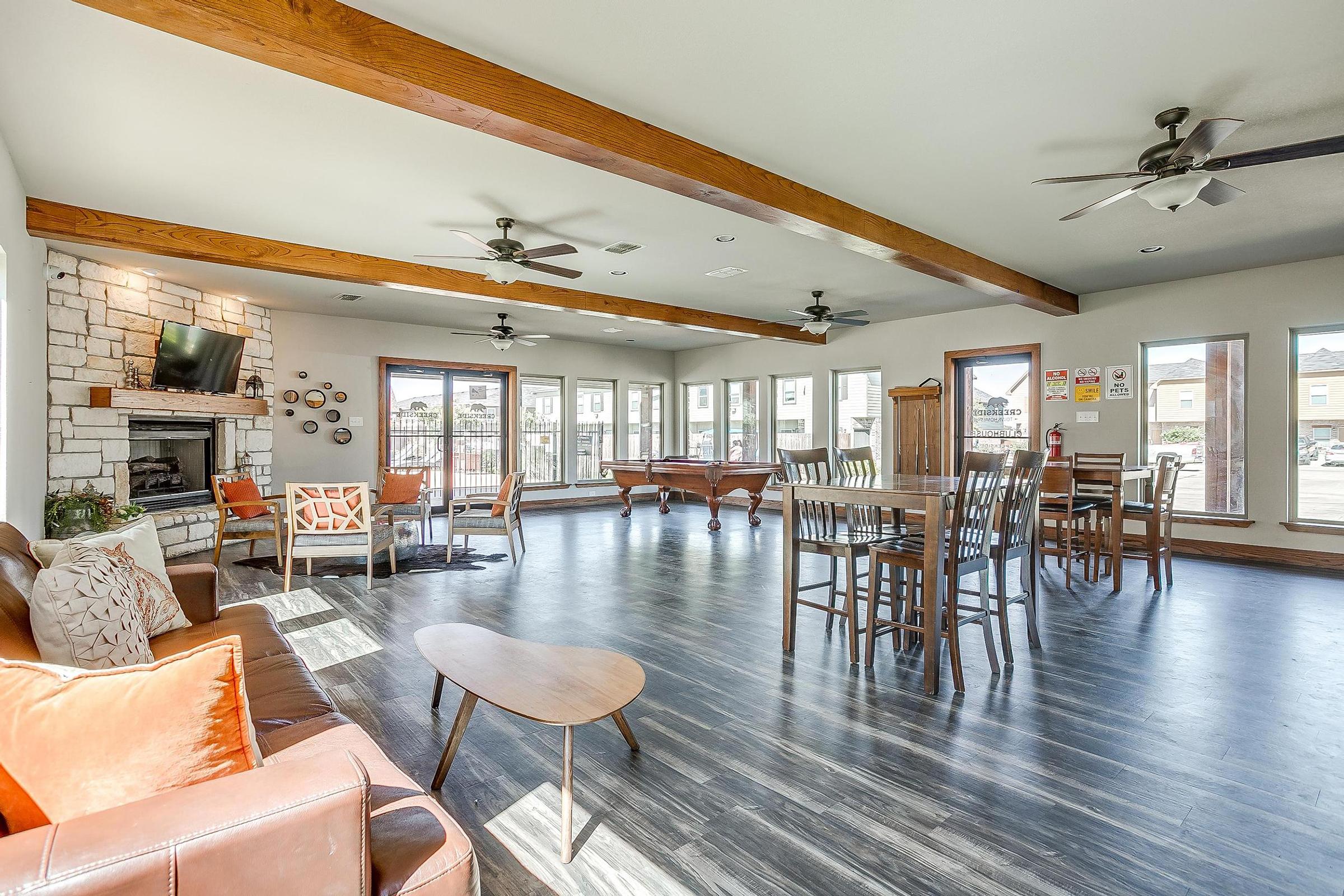 a living room filled with furniture and a table