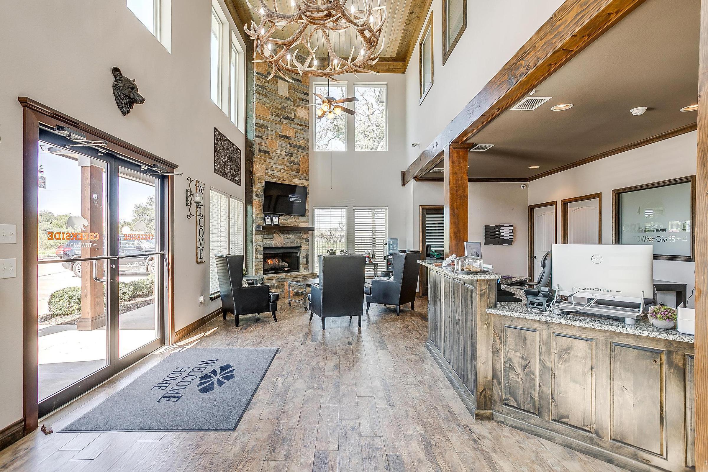 a room filled with furniture and a large window