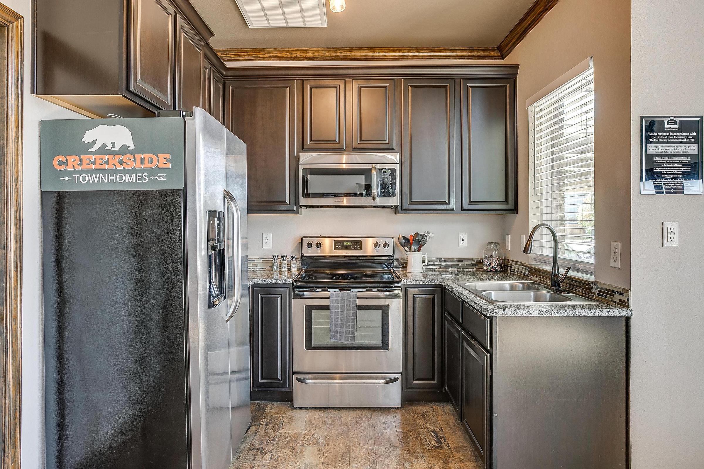 a kitchen with a stove top oven sitting inside of a refrigerator