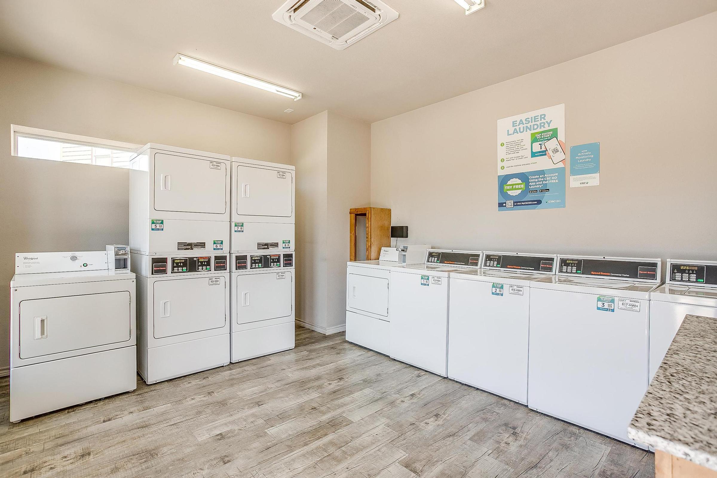 a kitchen with a sink and a refrigerator