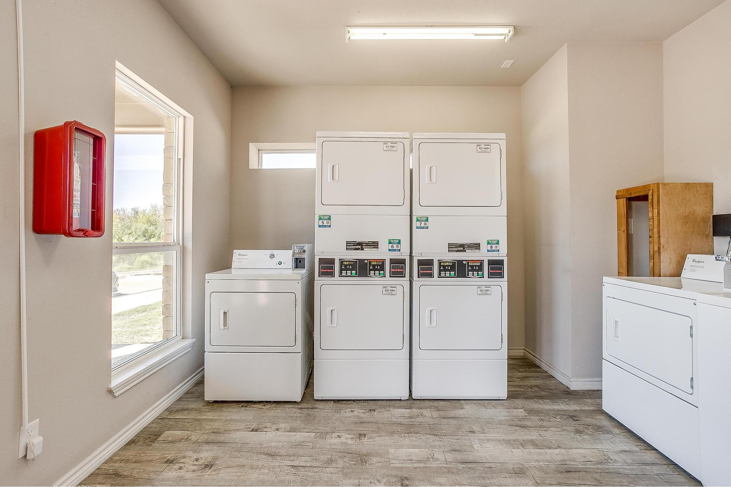 a kitchen with a sink and a refrigerator