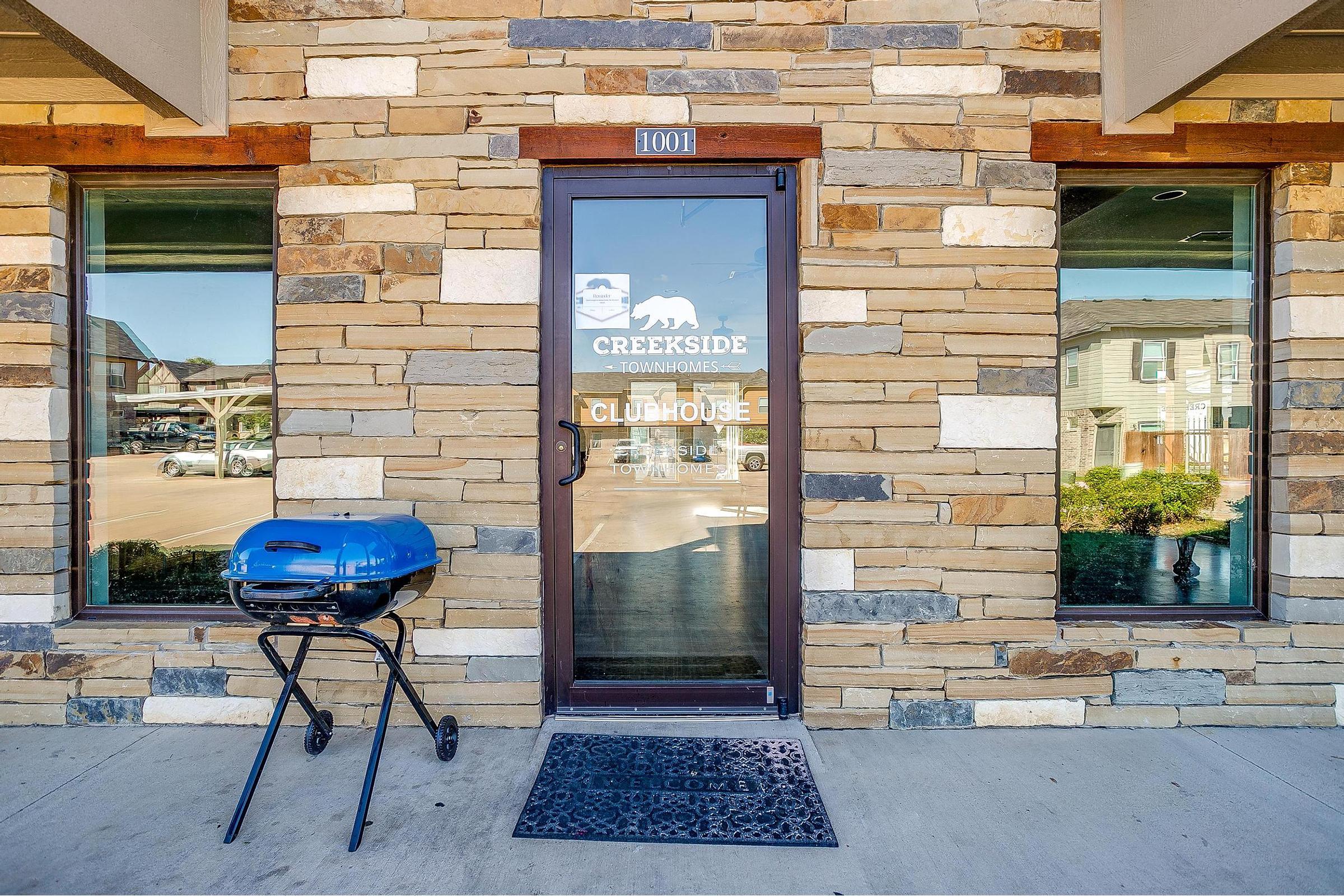 a chair sitting in front of a brick building