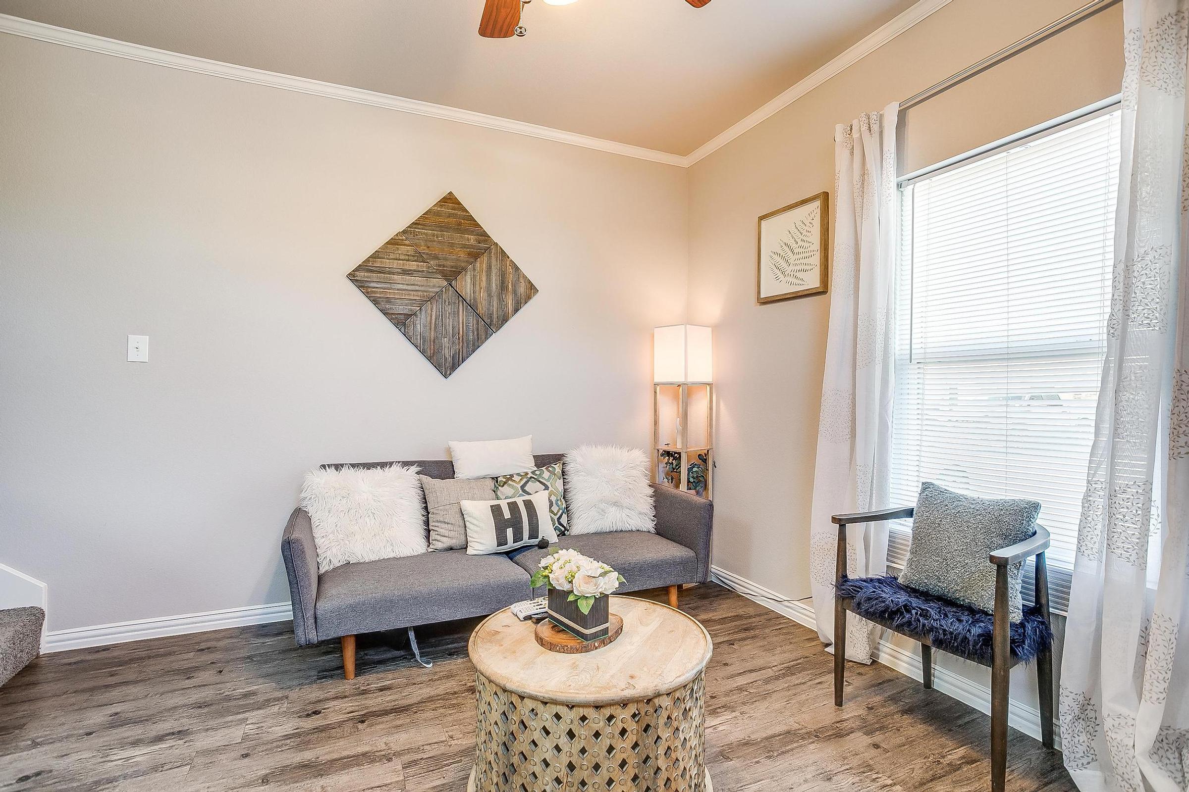 a bedroom with a fireplace and a chair in a room