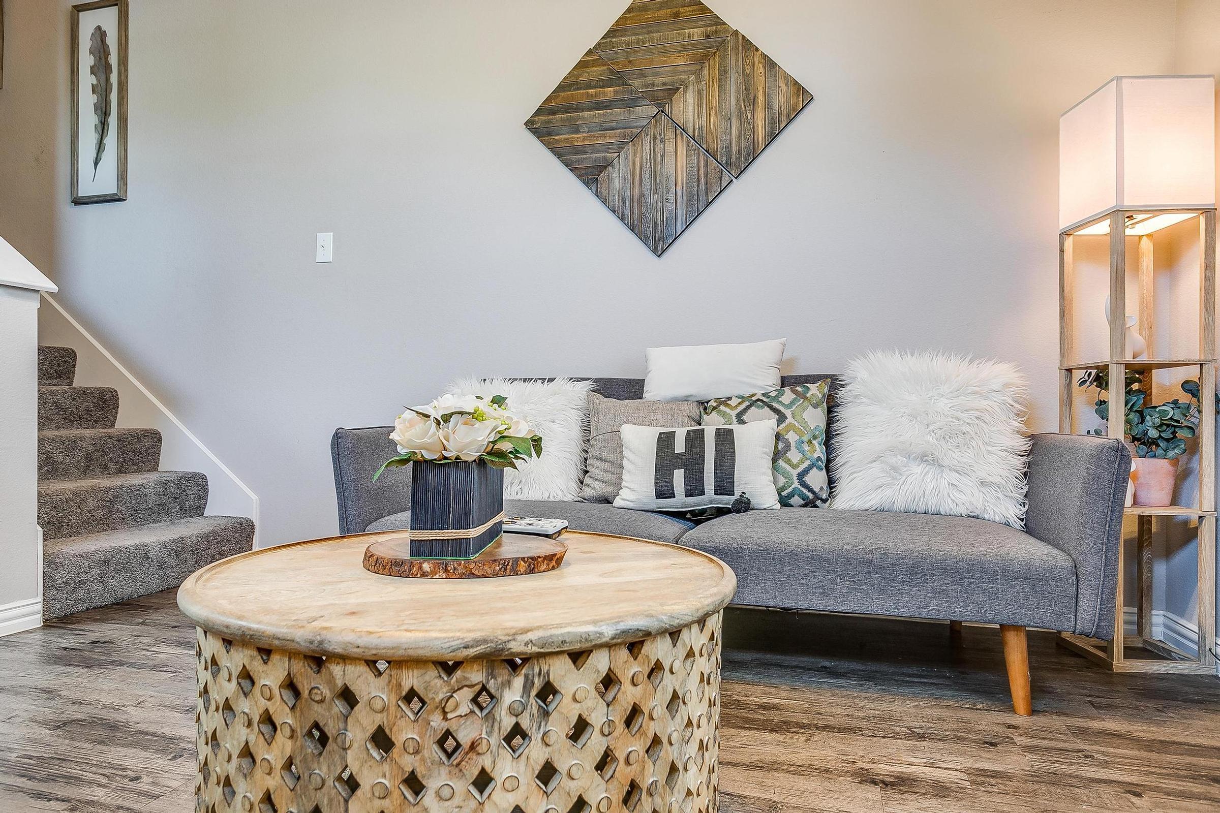 a room filled with furniture and vase on a table