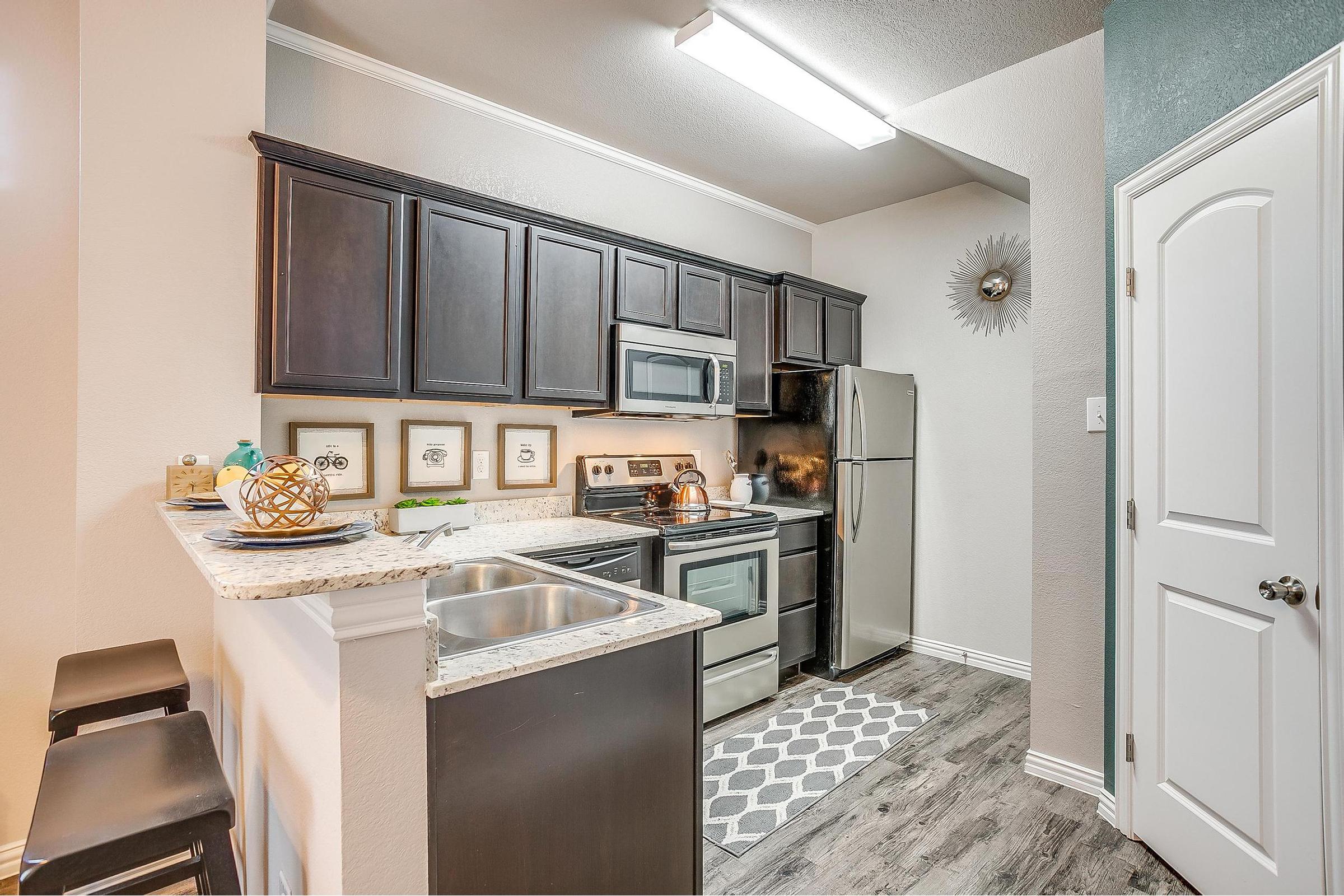 a kitchen with a sink and a window