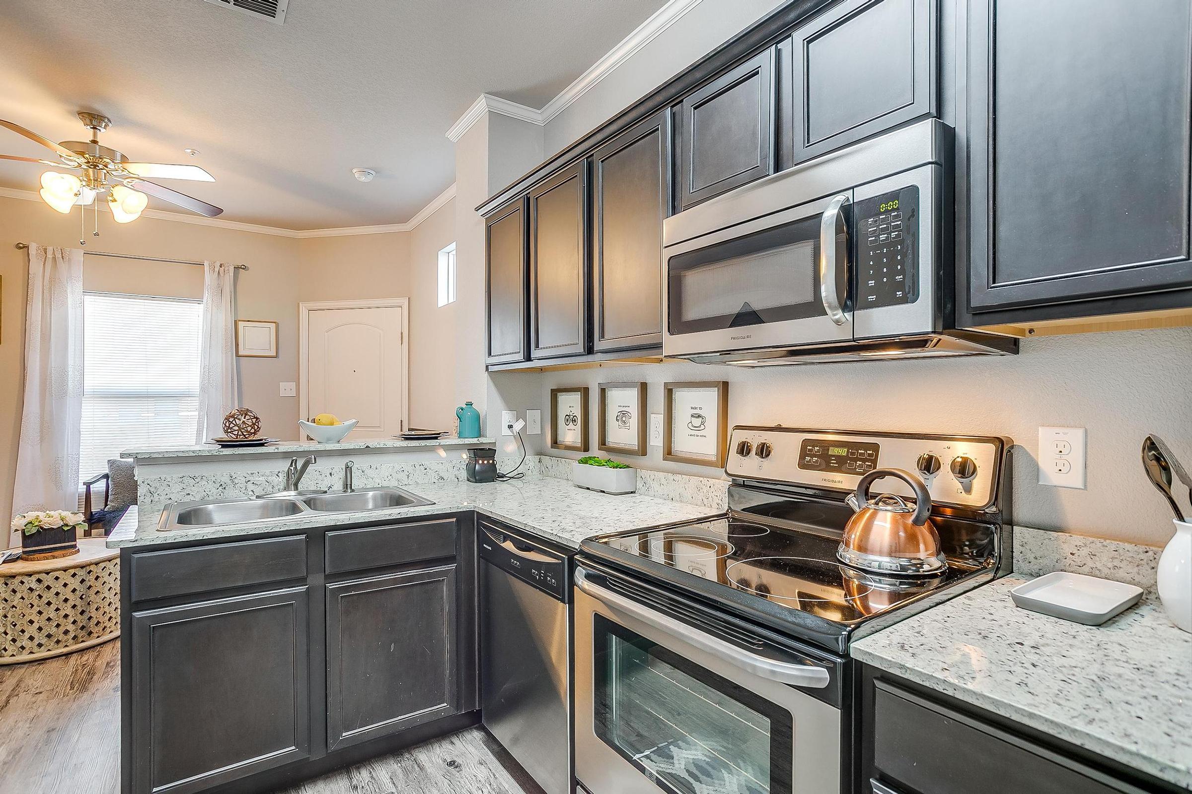 a kitchen with a sink and a stove