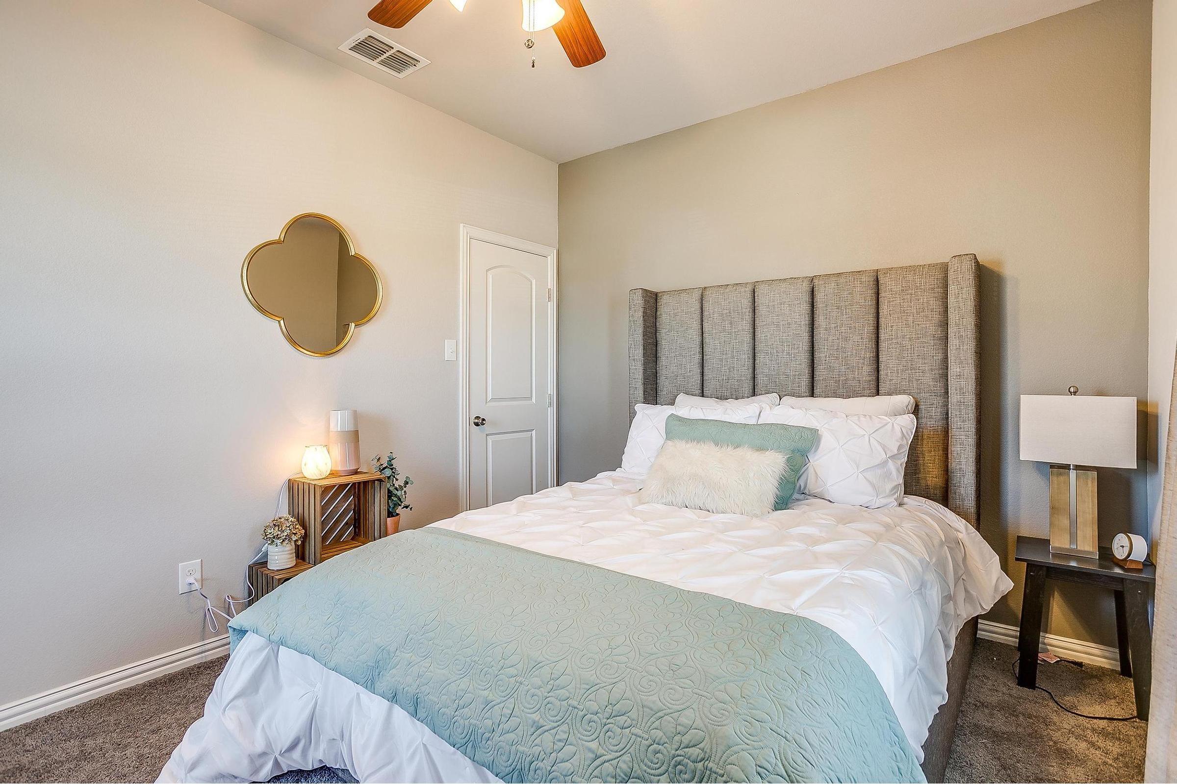 a bedroom with a large bed in a hotel room