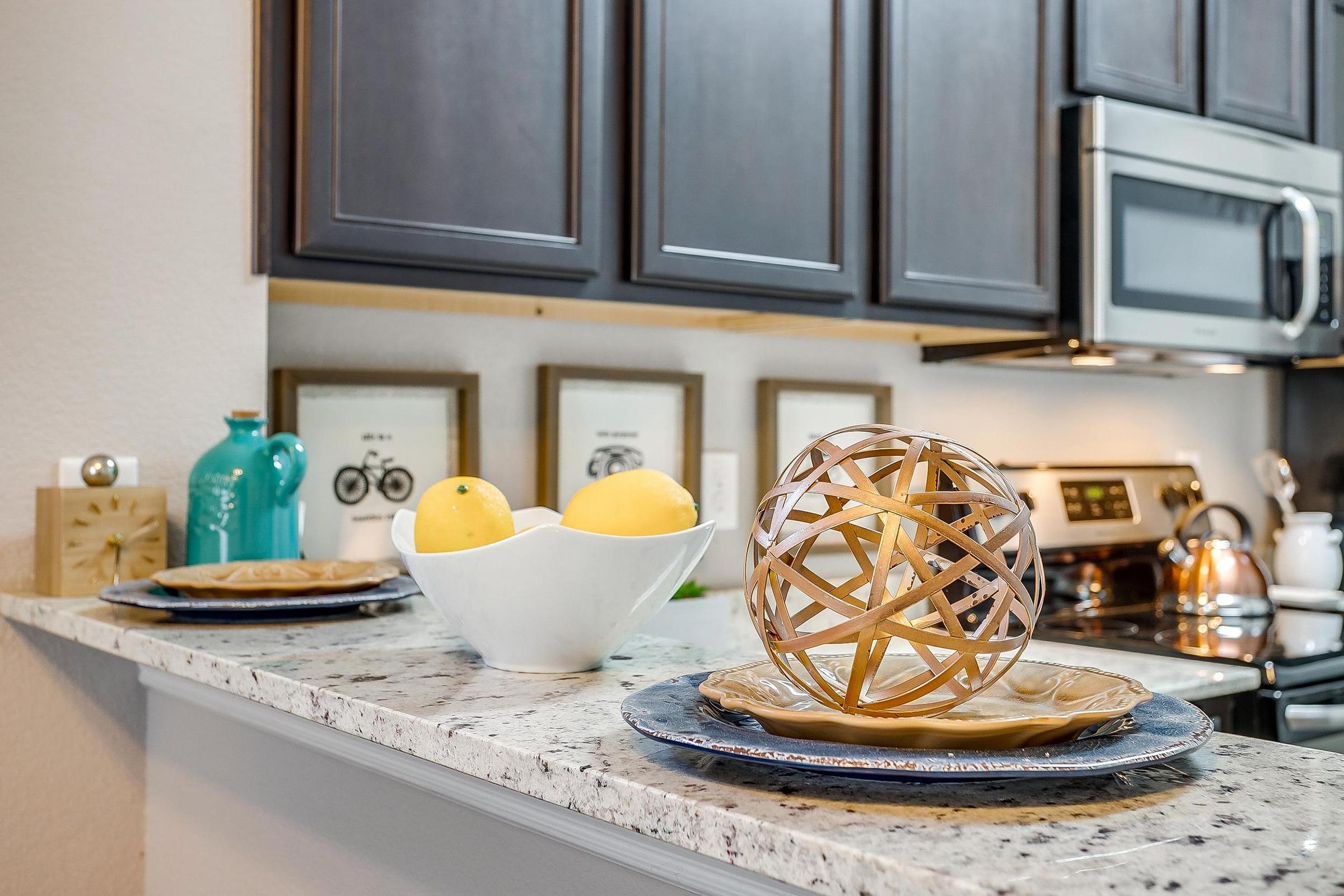 a stove top oven sitting inside of a kitchen