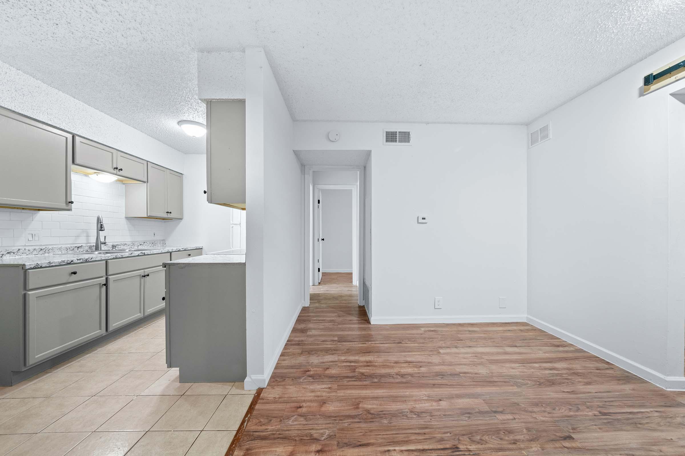 a kitchen with a wooden floor