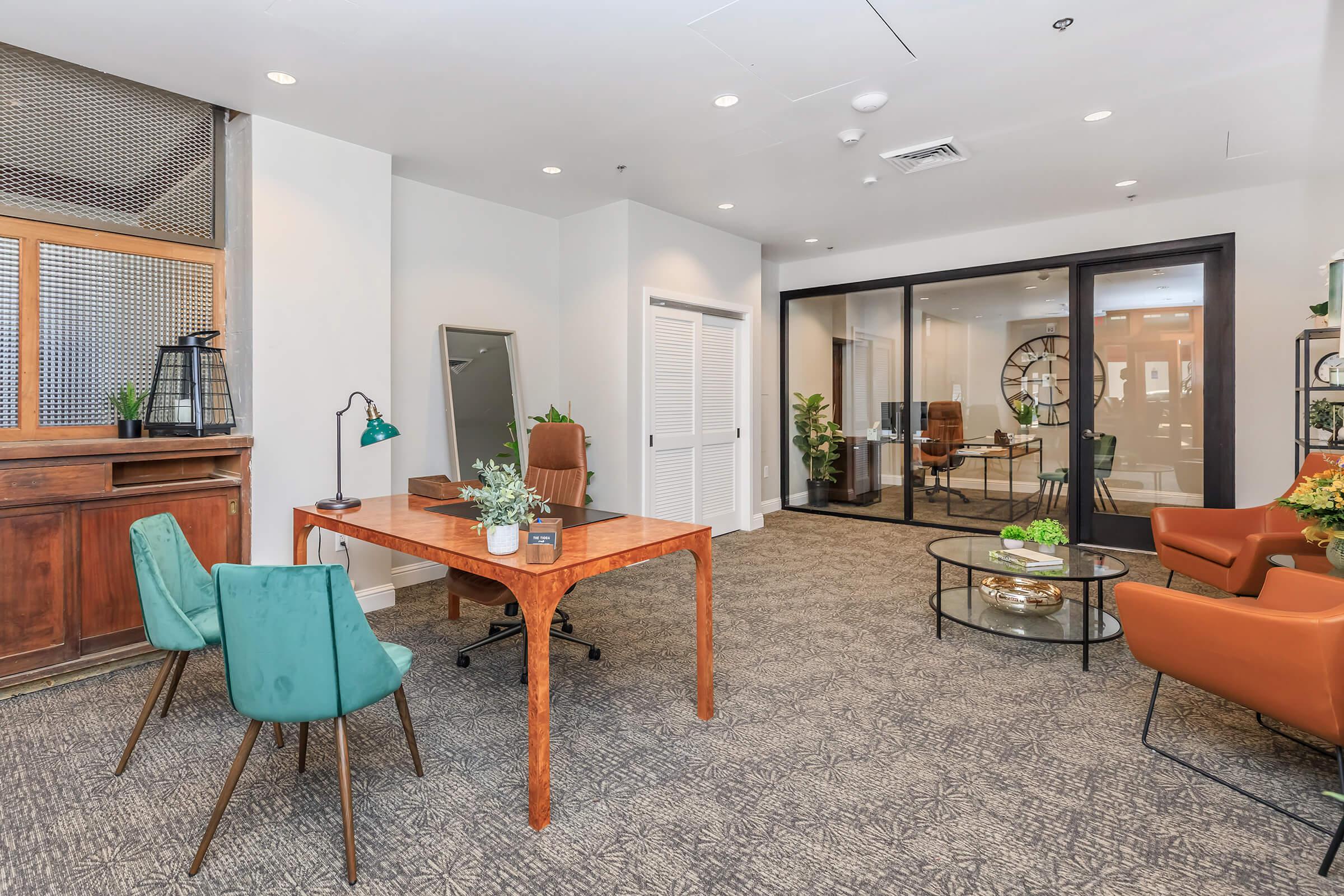 a living room filled with furniture and a large window