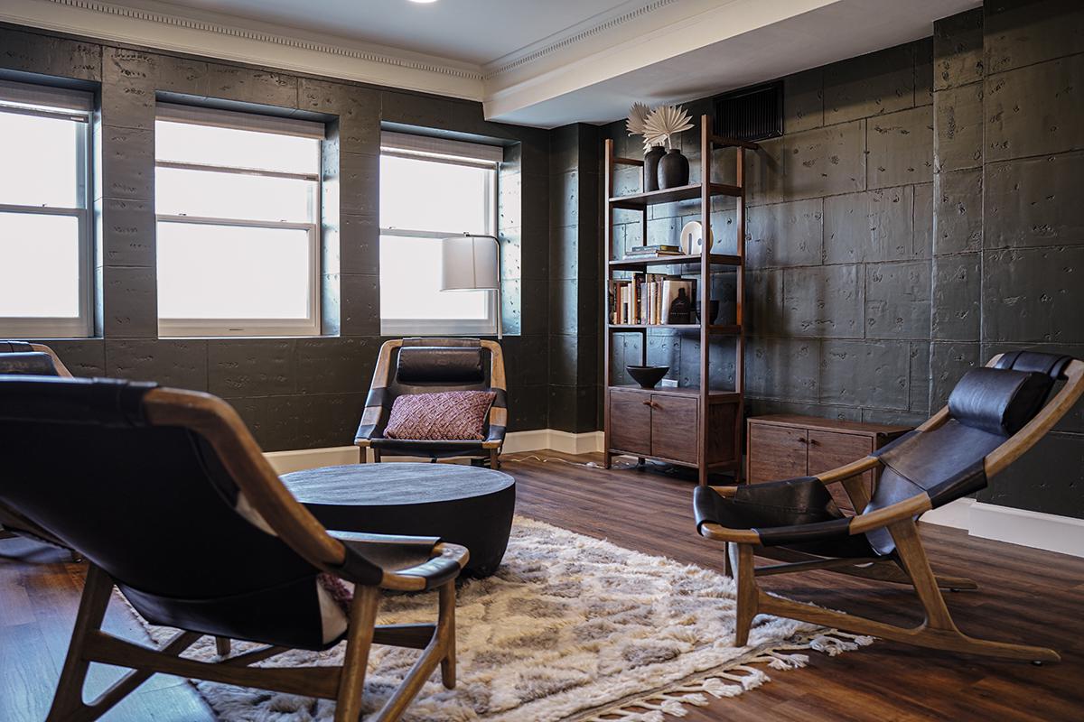 a living room filled with furniture and a large window