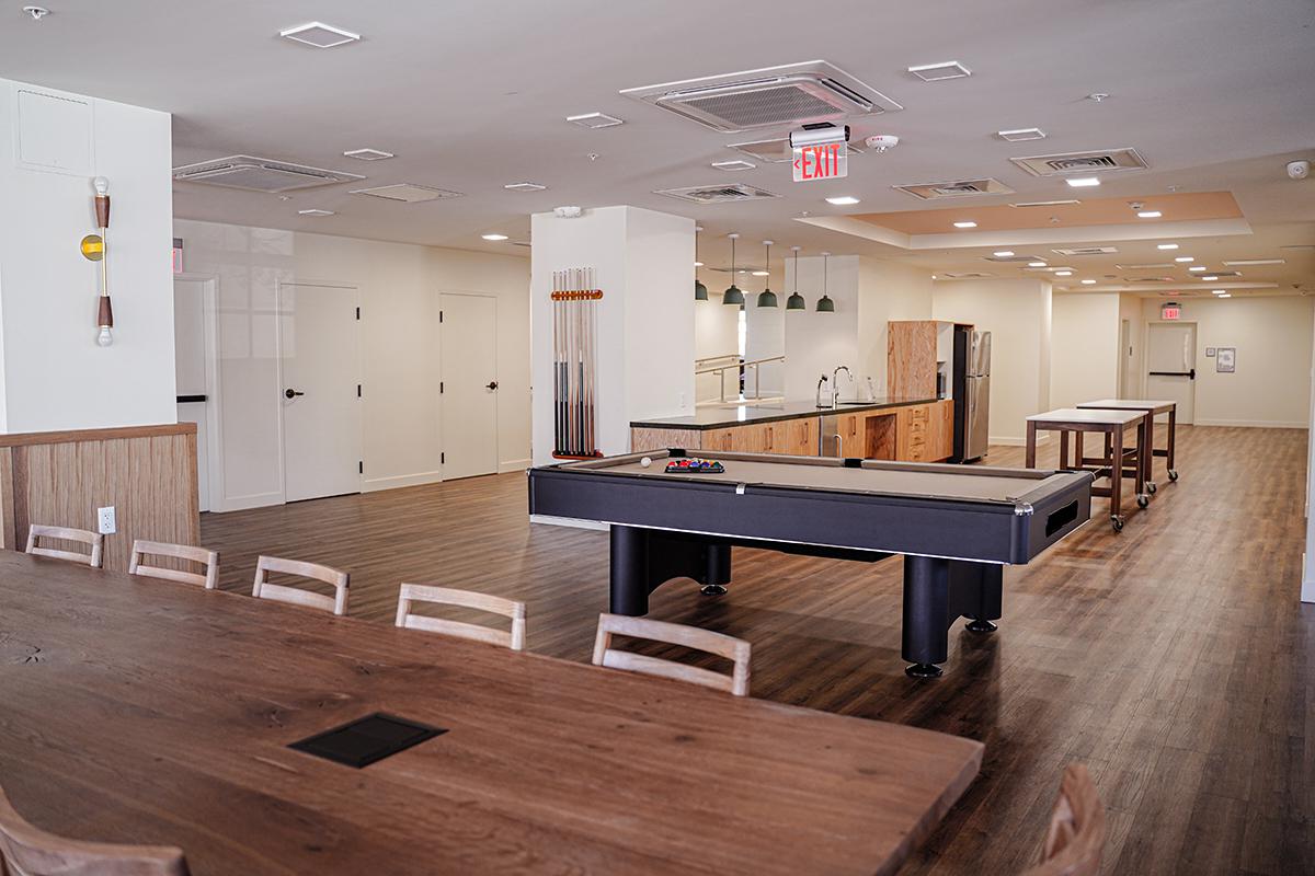 a room filled with furniture on top of a wooden table