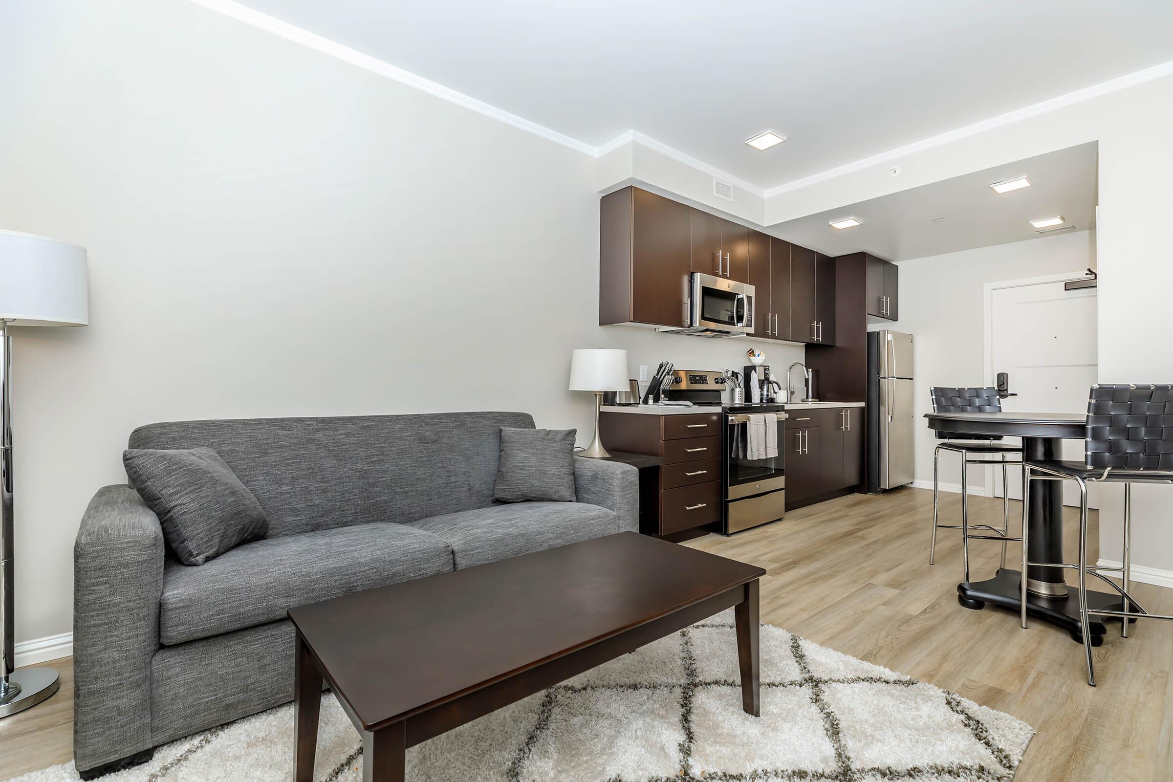 a living room filled with furniture and a flat screen tv