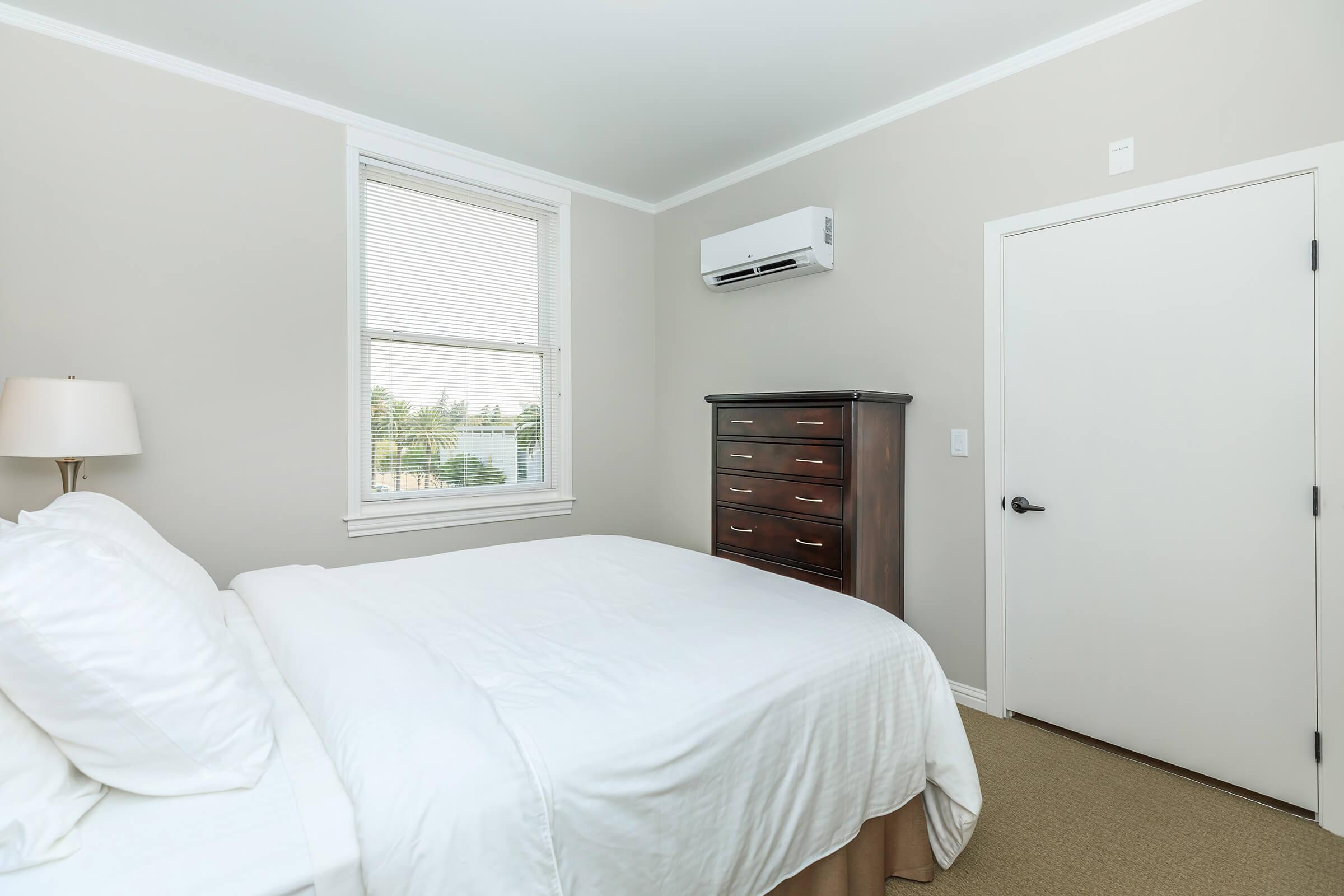 a bedroom with a bed in a hotel room