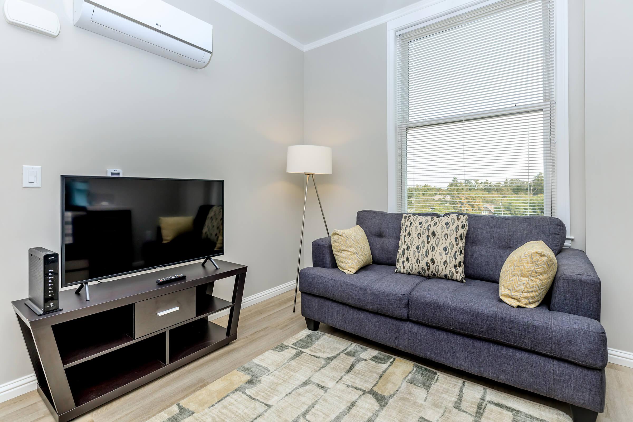 a flat screen tv sitting in a living room